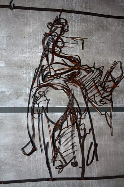 A MAN HELPING A RIDER ON A HORSE. 2009. Metal, welding. 151 x 150 x 38 cm.