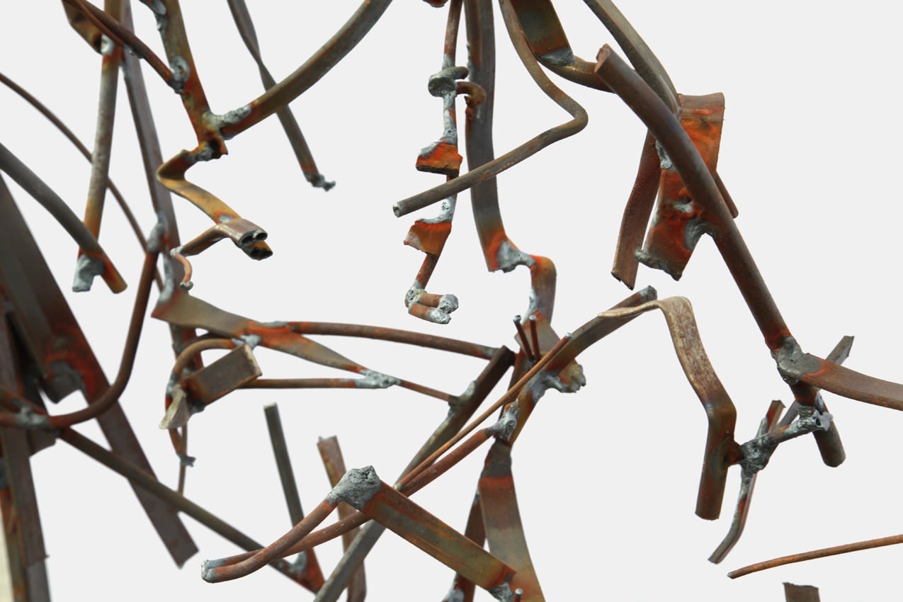 A SEATED MAN IN HIGH CAP. 2009. Metal, welding. 120 x 100 x 30 cm.