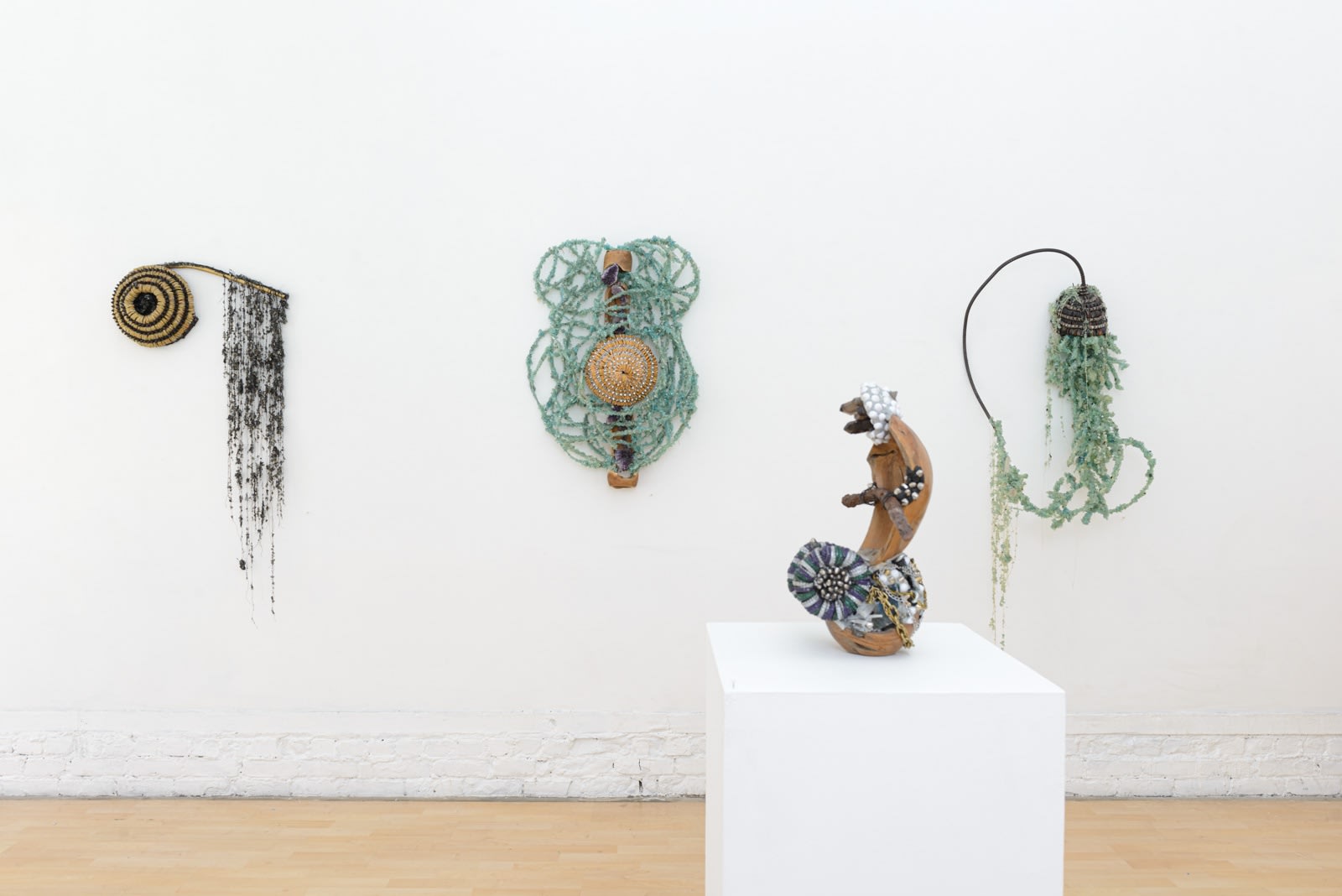 Installation view of Lucien Shapiro's solo show "Oculus", featuring found-object ritual sculptures