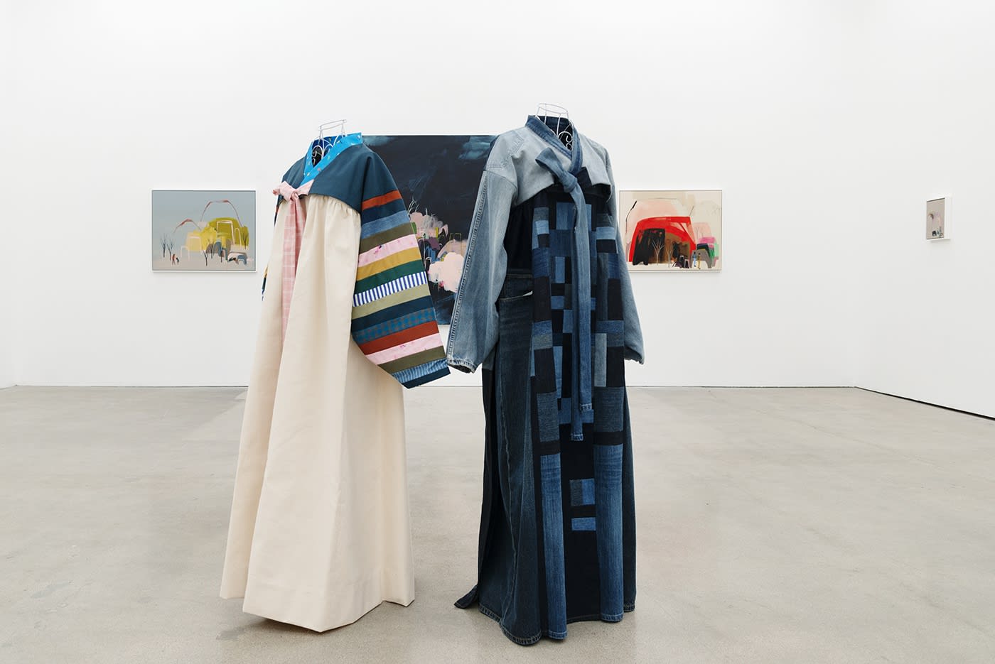 Seonna Hong at Hashimoto Contemporary Los Angeles installation view of hanbok in foreground, paintings in background