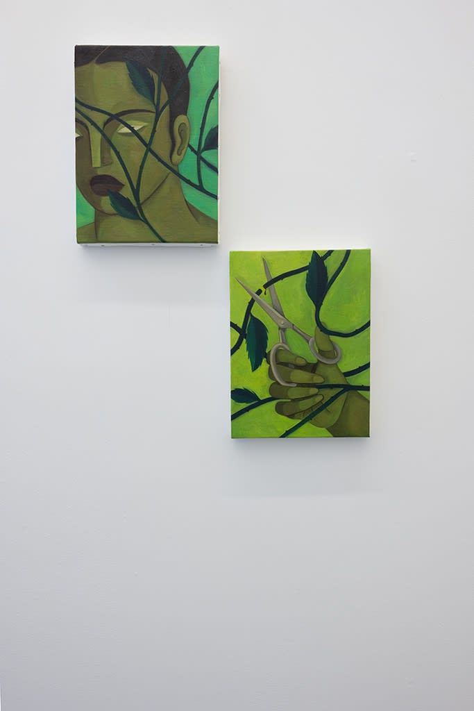 Installation photo of Hilda Palafox paintings of green women