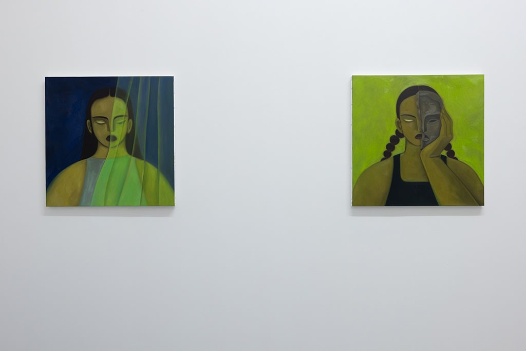 Installation photo of Hilda Palafox paintings of green women