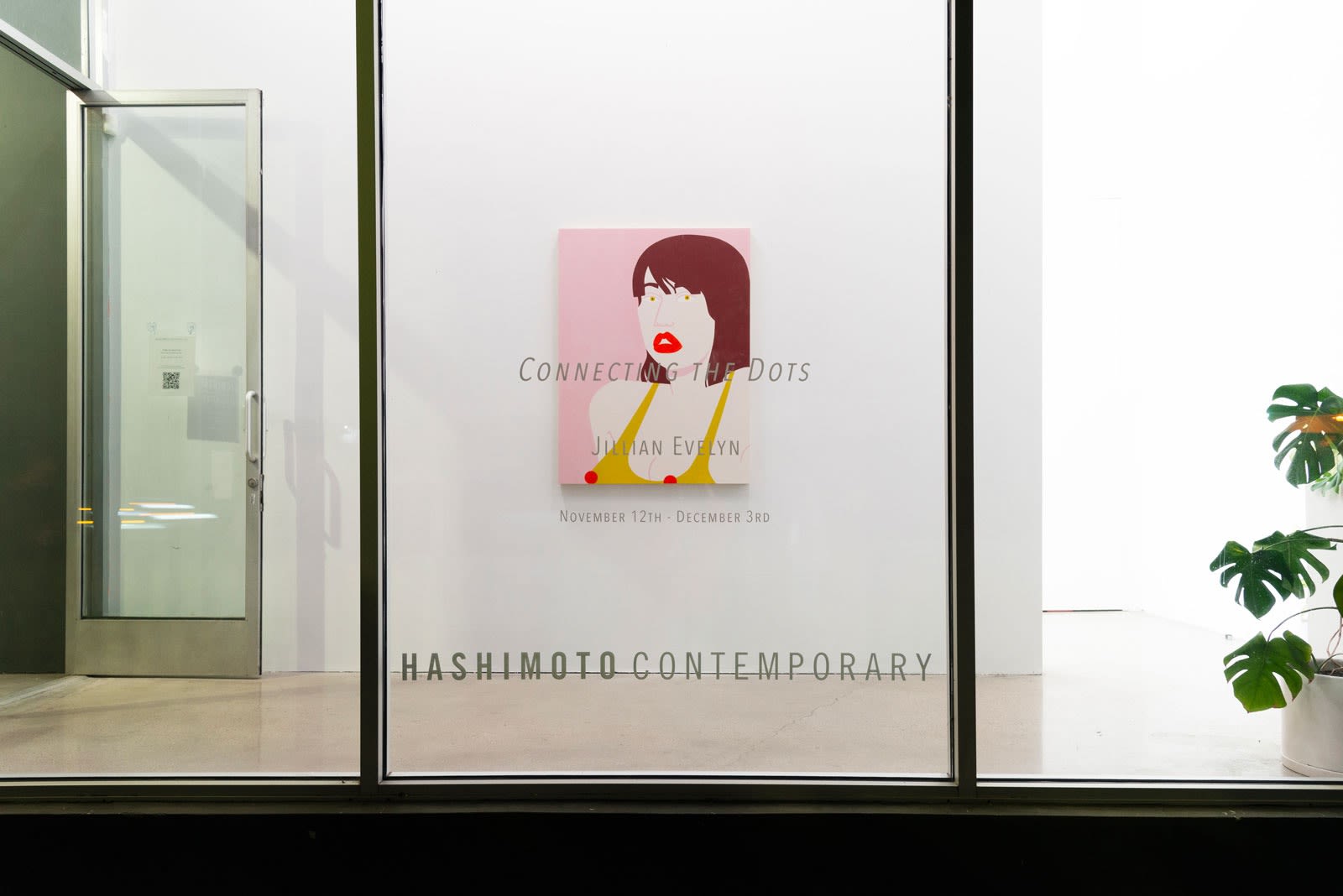Installation shot of the gallery front window with show title and painting "Eyeful" on the wall behind the window.