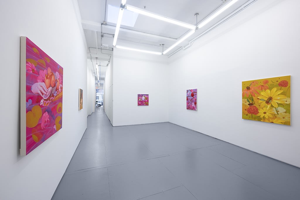 installation image of bright colored paintings by Megan Ellen Macdonald