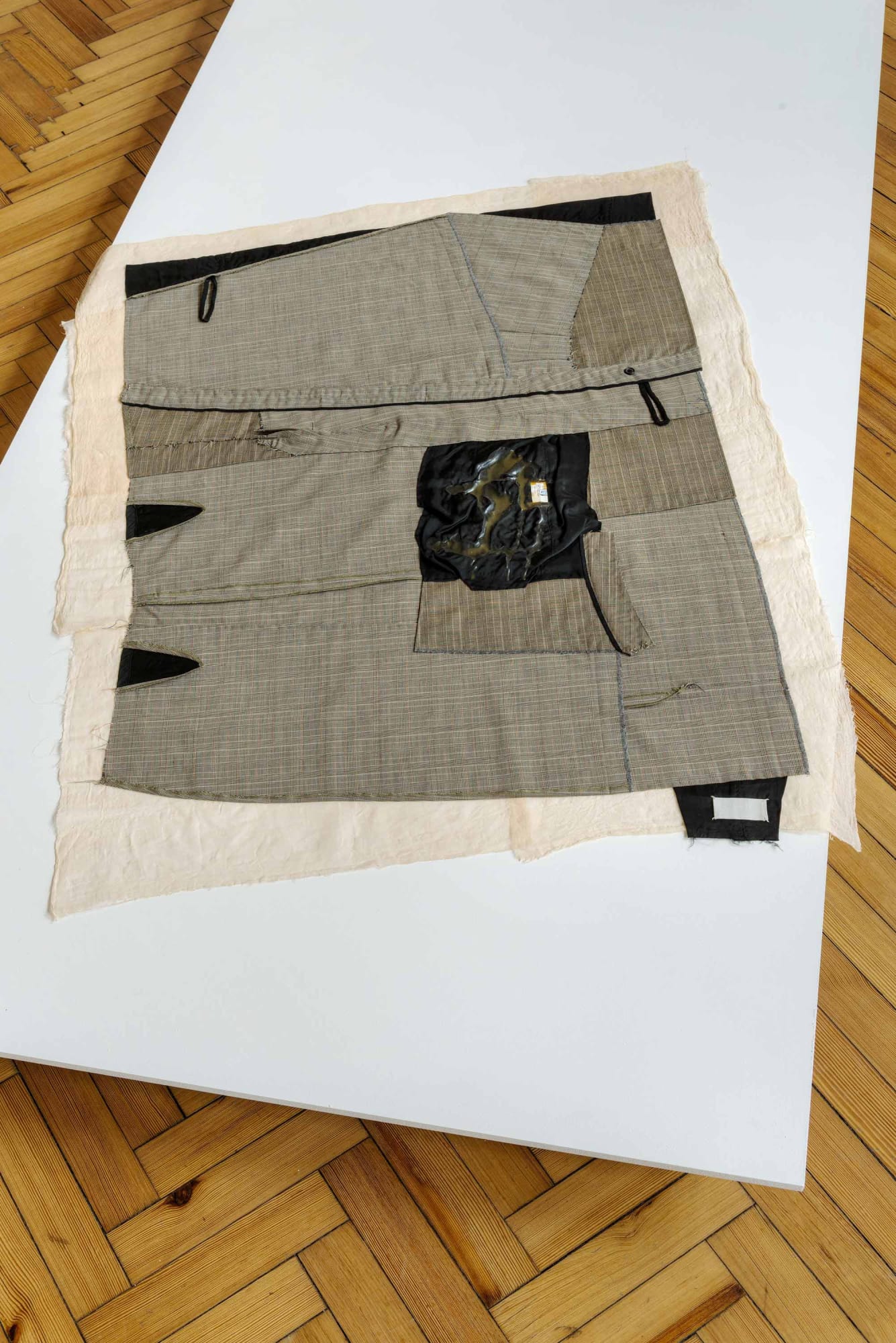After Cutting, 2024 Martin Margiela wool suiting skirt and lining 2000-2001, polyester thread, cotton muslin, acrylic paint, latex 130x99cm