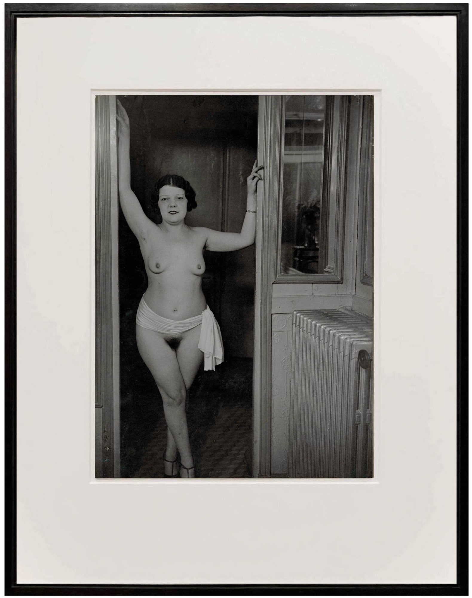 Nude woman in doorway chez Suzy in Paris 1930s by Brassai
