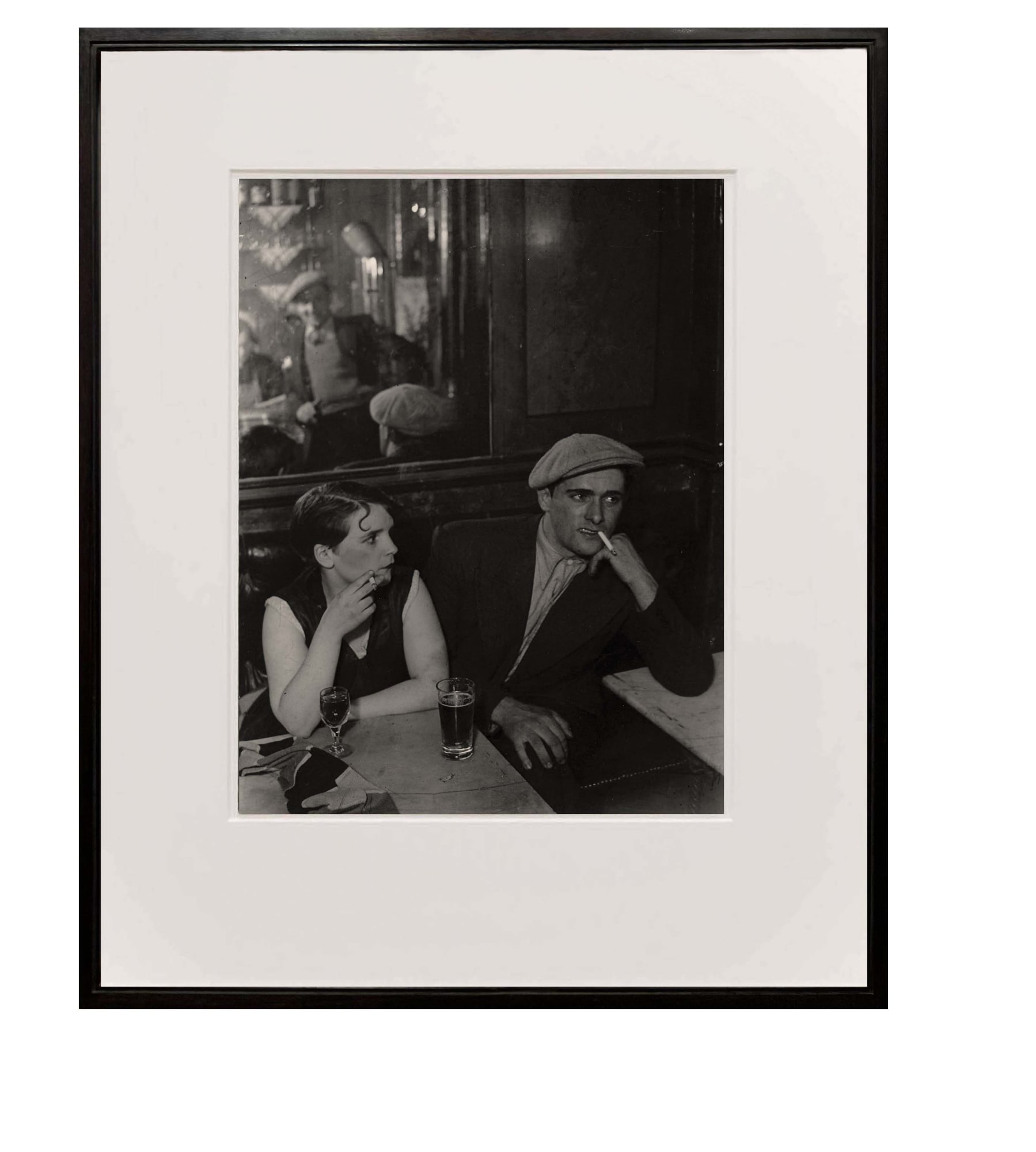 framed photograph of couple at a cafe at night from Paris de Nuit by Brassai