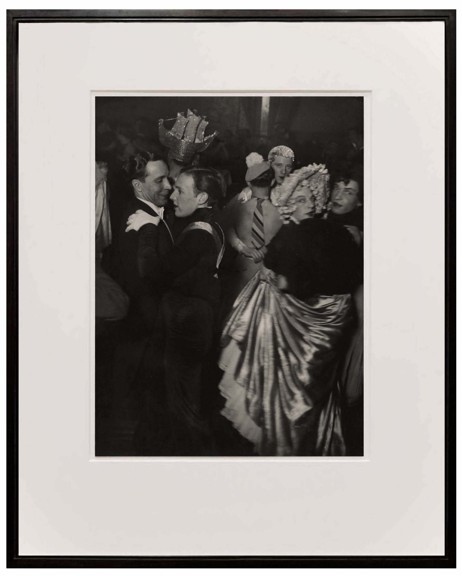 framed photograph of men dancing together at a ball from Paris de Nuit by Brassai