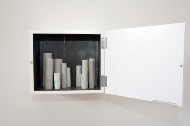 South South East 2007 Lead-lined white laquered cabinet, porcelain vessels in various glazes