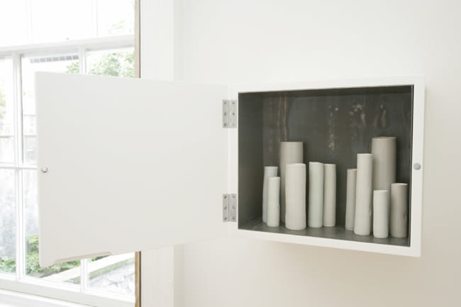 North North East 2007 Lead-lined white laquered cabinet, porcelain vessels in various glazes