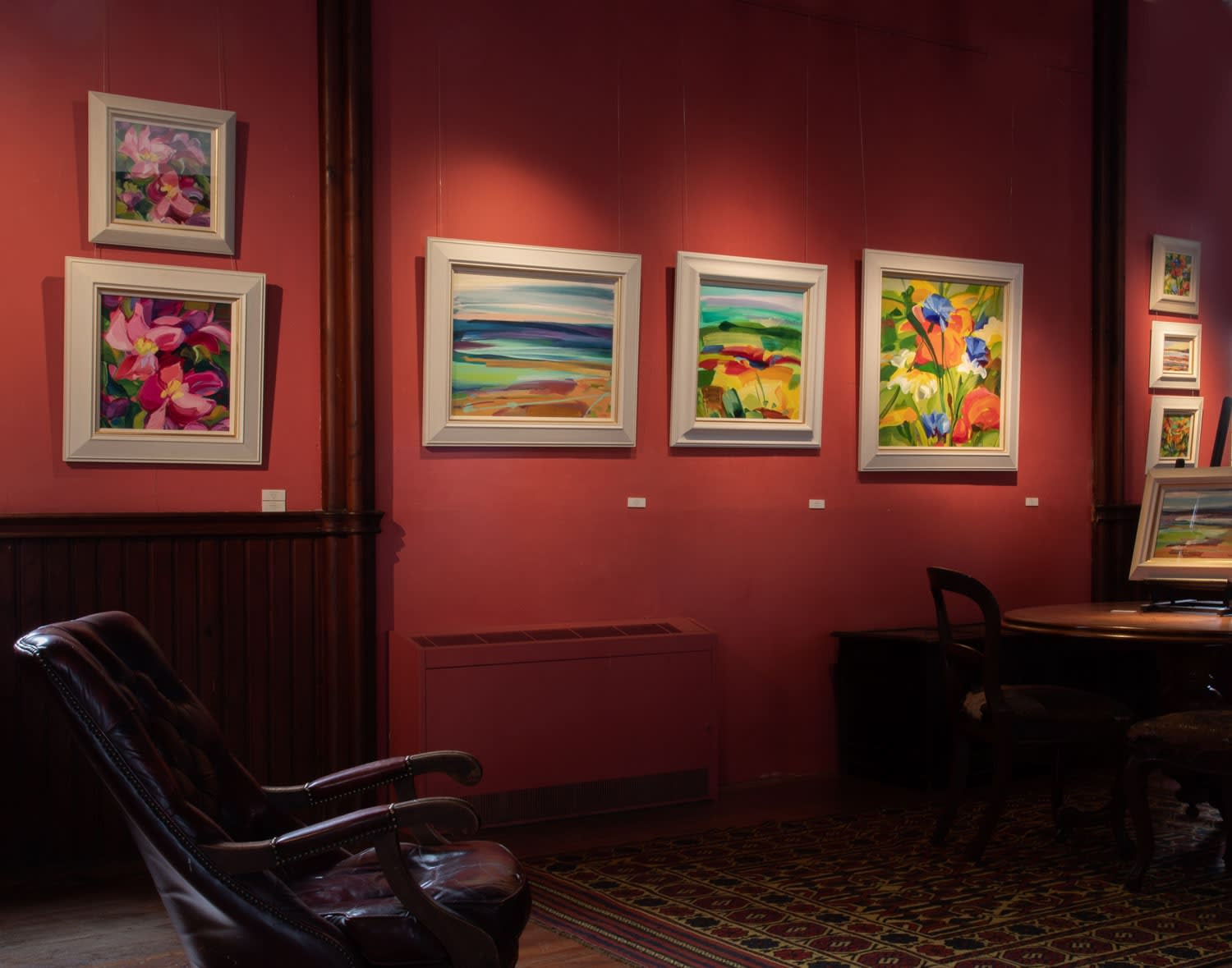 Paintings by Shona Barr hanging in Kilmorack Gallery