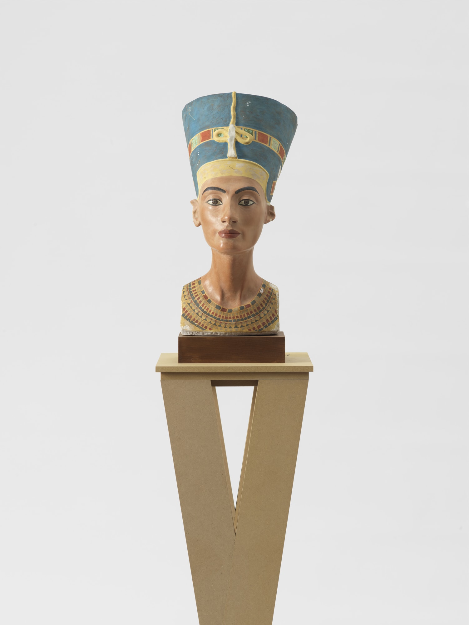 Isa Genzken Nefertiti, 2018 Plaster bust on wooden base, MDF plinth, postcard, sticker, and ink 74