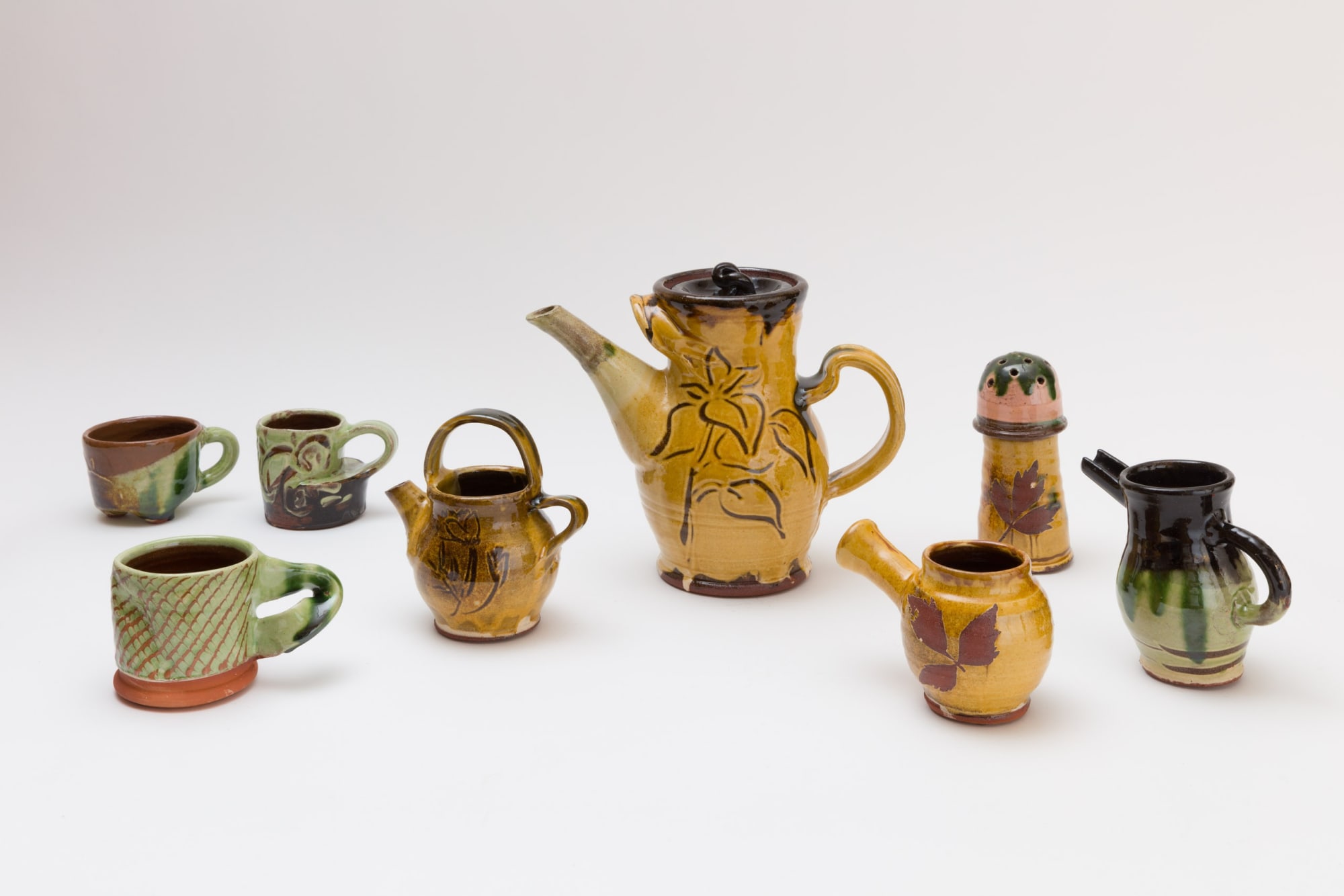 Simon Bayliss Coffee Set (for nuance in conversation), 2025 Terracotta, coloured slips, with clear and copper glaze