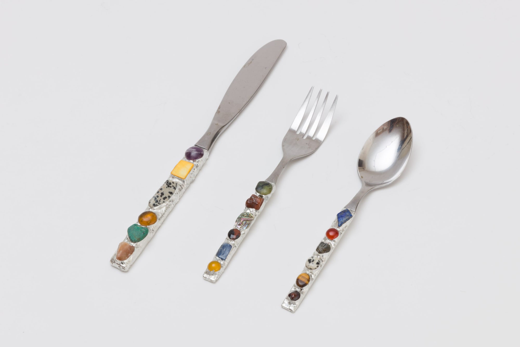 The Perfect Nothing Catalog Cutlery, 2025 Tin and various stones on found objects