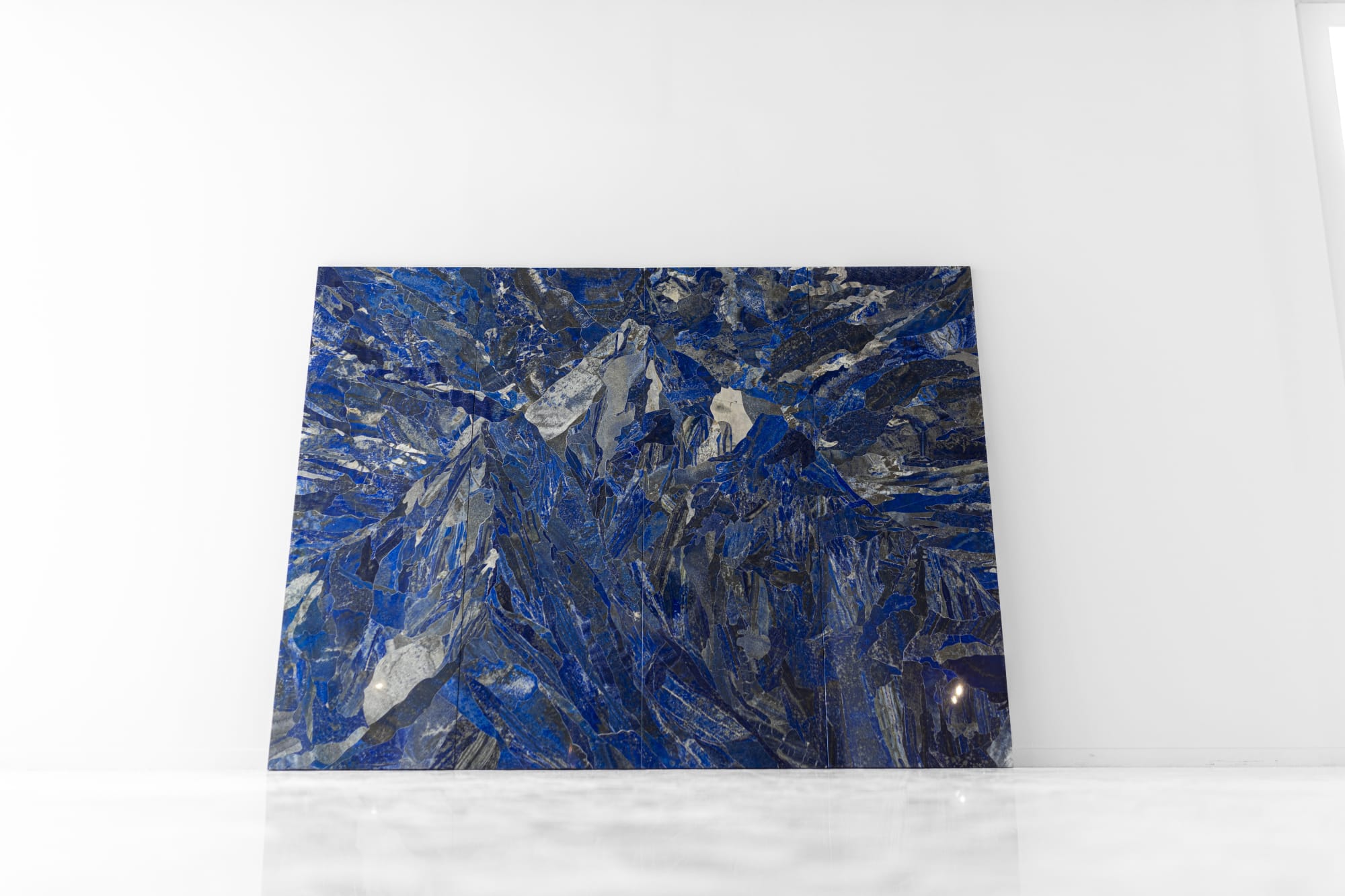 Installation view, Hamra Abbas, Mountain 1, 2022, Lapis lazuli, granite, 182.88 x 243.84 cm, 72 x 96 in. Photo: Misk Art Institute.