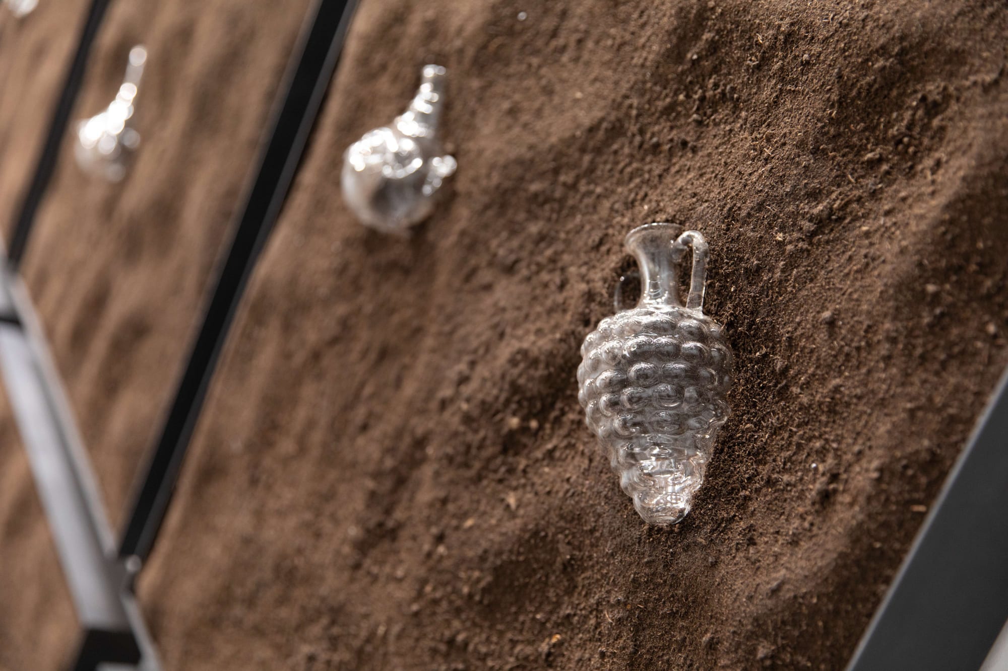 Dima Srouji, Maternal Exhumations 3 (Detail), 2024, Handblown glass vessels, soil, steel, Courtesy of the artist and Lawrie Shabibi
