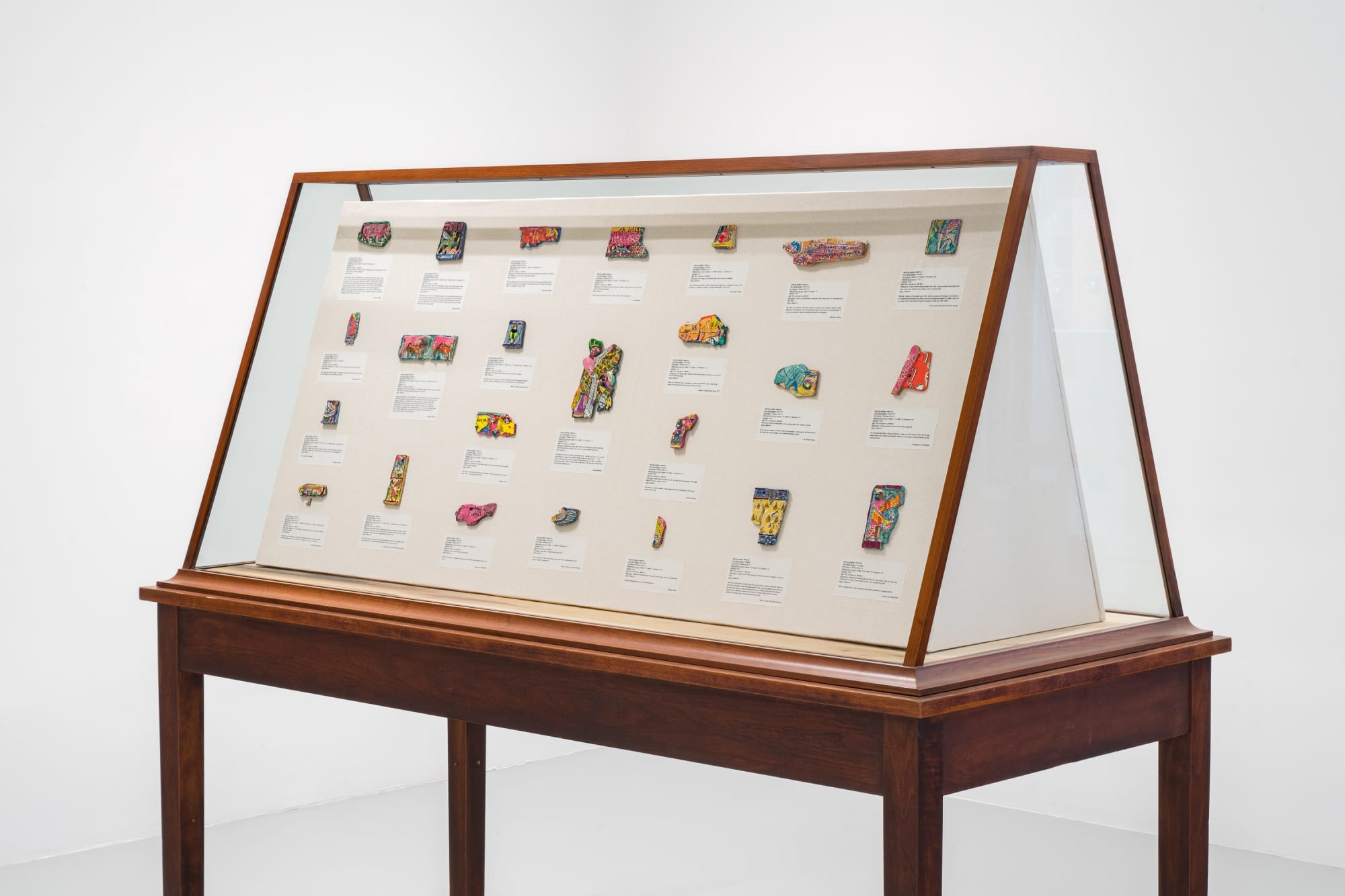Michael Rakowitz The invisible enemy should not exist (Vitrine 2 - ivories), 2023 Glass vitrine, Middle Eastern food packaging and newspaper, glue 68 x 78 x 36 1/4 in 172.7 x 198.1 x 92.1 cm