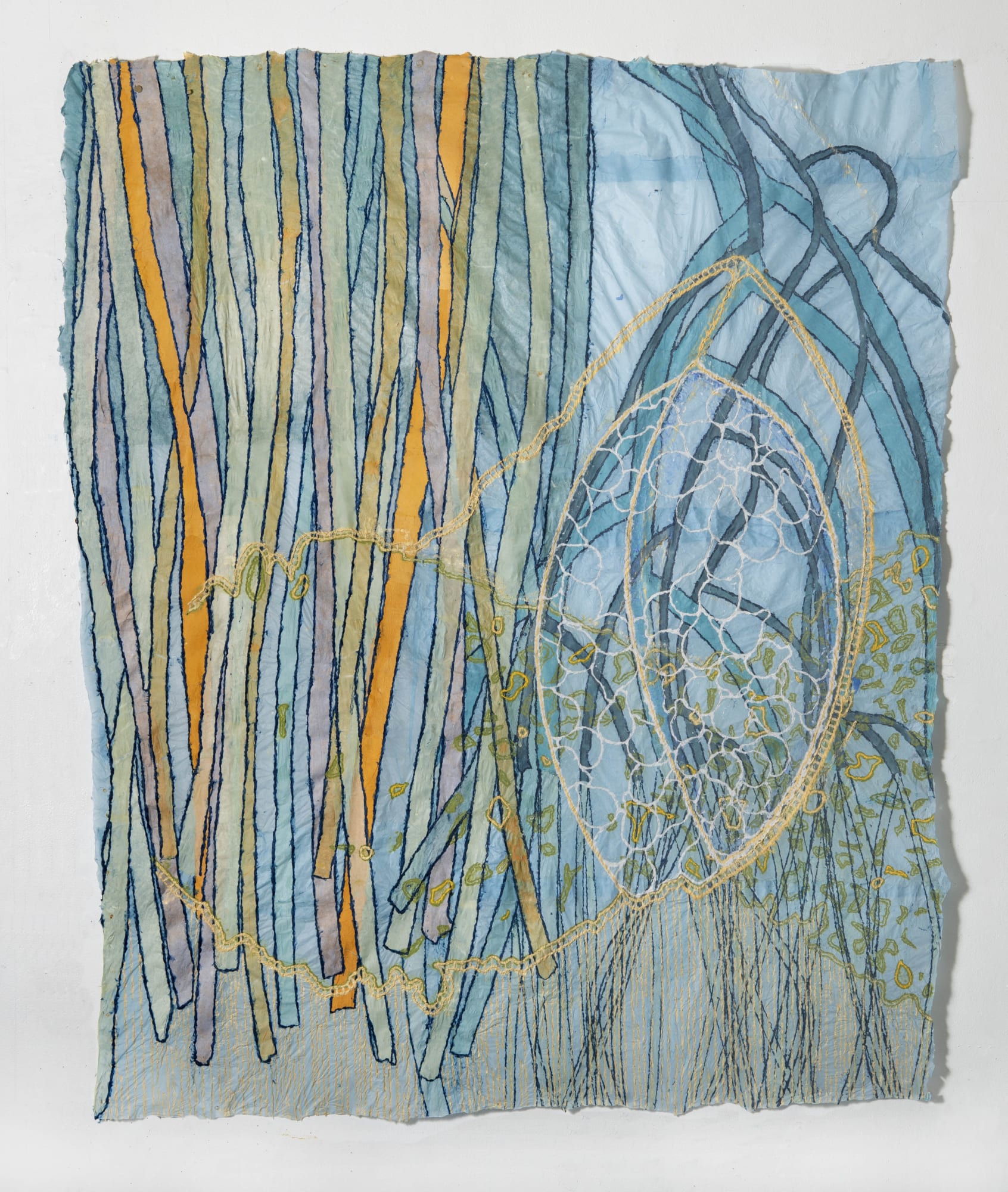 Nancy Cohen's "Scrim" done with paper pulp, ink and handmade paper in various shades of blue, purple, green, orange and yellow. The piece depicts many strings interlining with each other on a blue layer among other design layers.