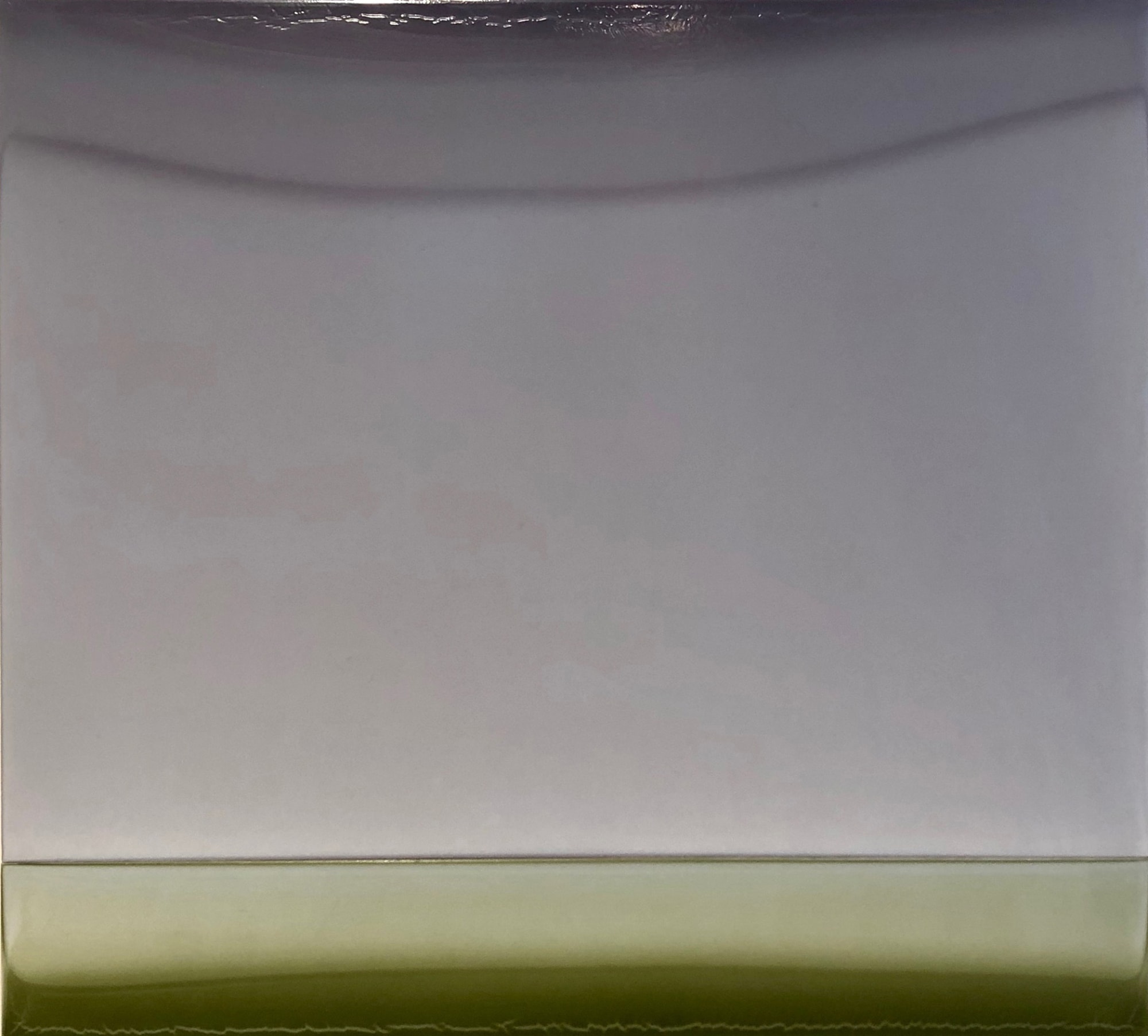 Susan English's "Wide" created in tinted polymer on panel in shades of gray and green. The work is a simple small layer of muted green on top of a layer of negative space creating an illusion of depth.