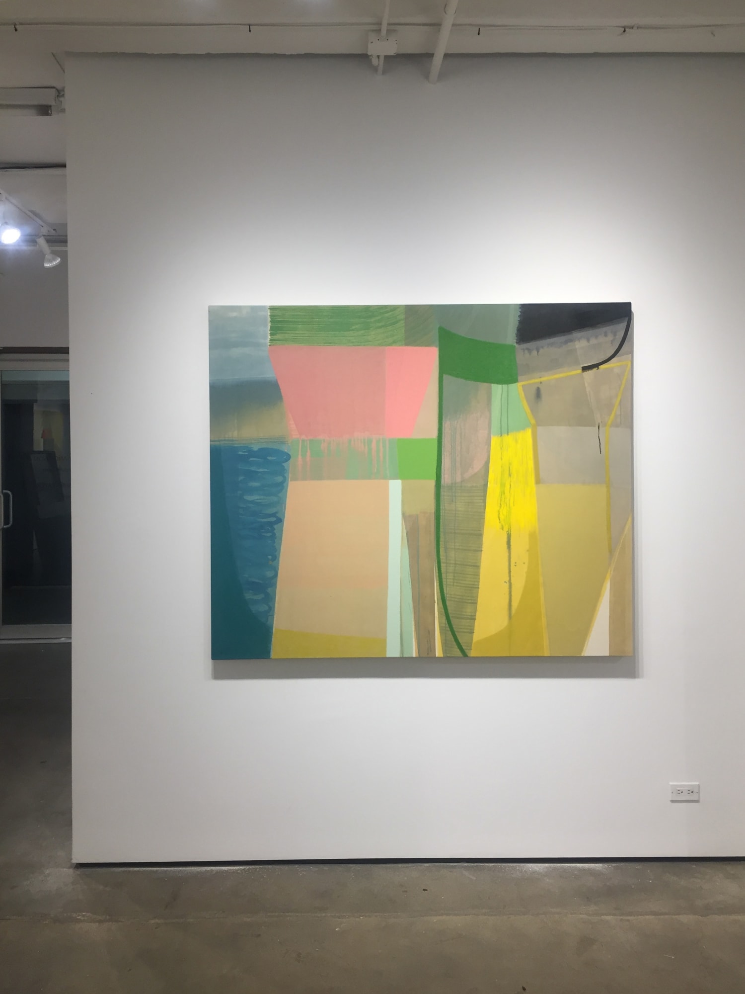 Installation shot of Ky Anderson's "Forest" painting. An abstract pigment, acrylic and oil painting on canvas in shades of green, blue, pink, yellow, tan, gray and black.