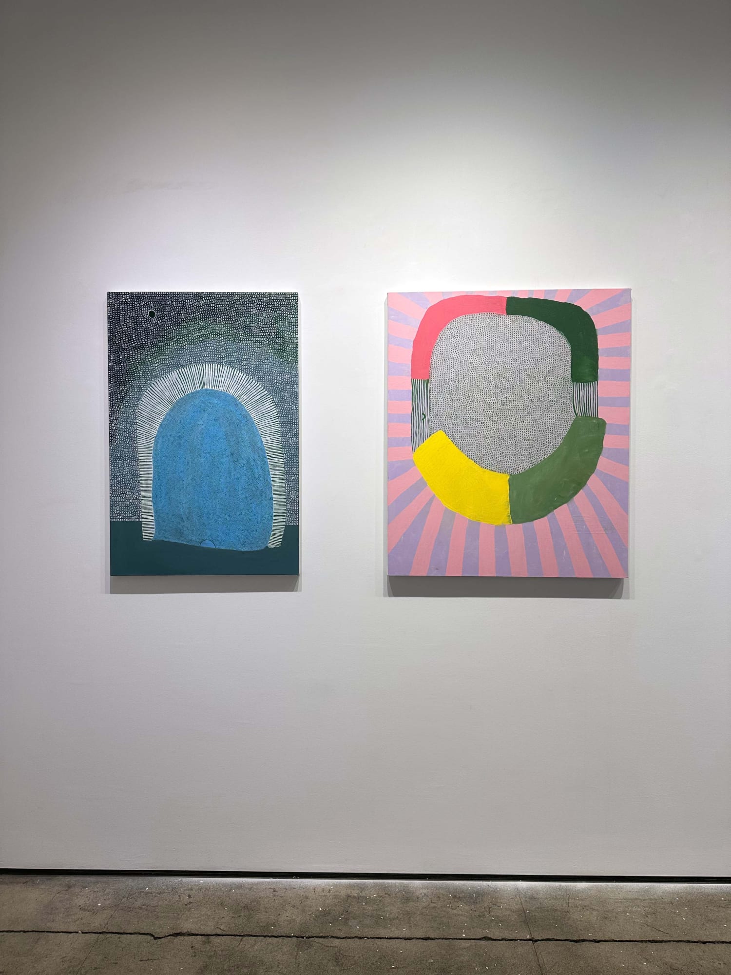 exhibition with  two abstract paintings of equal size on a wall