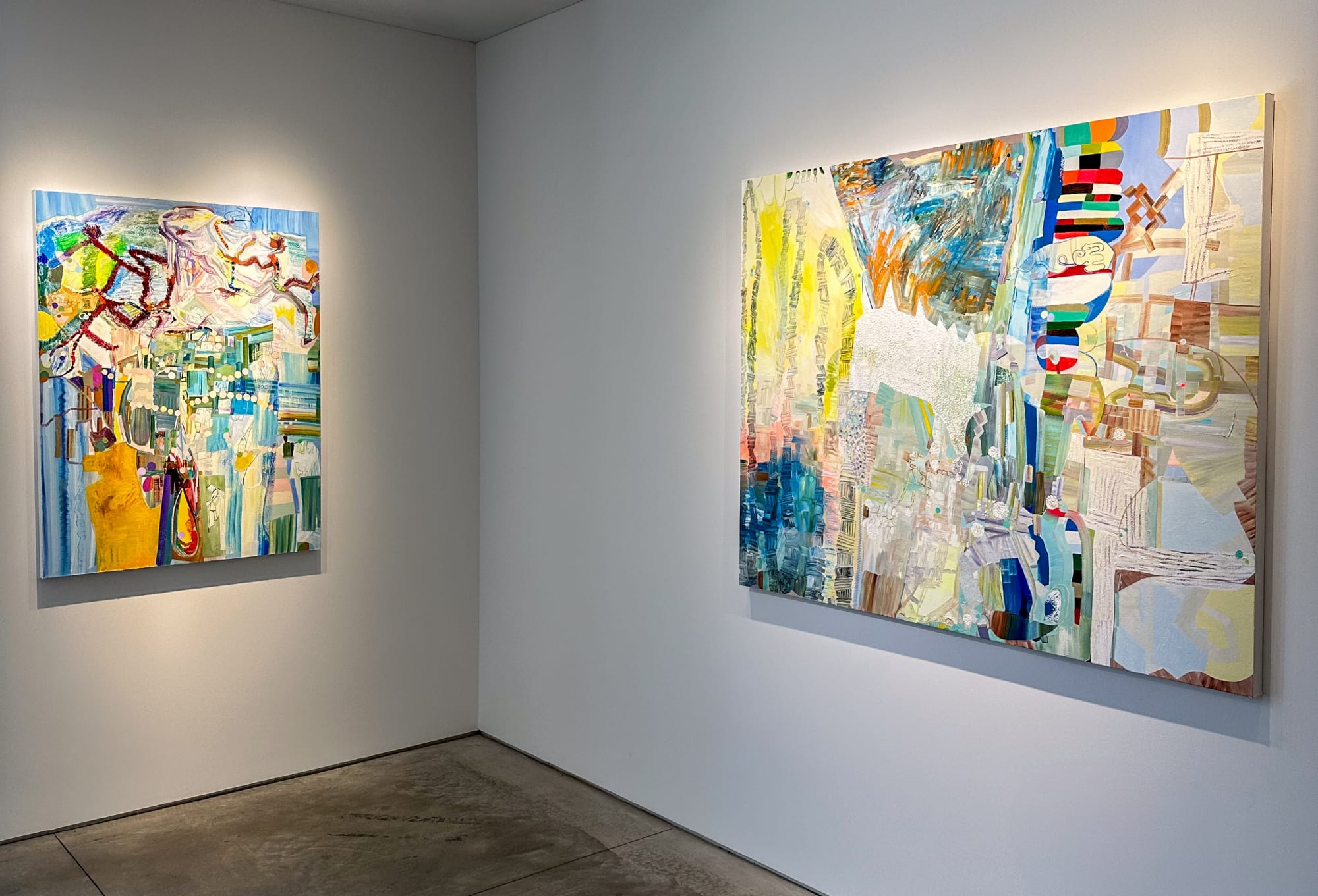 exhibition with two large colorful abstract oil paintings on the walls