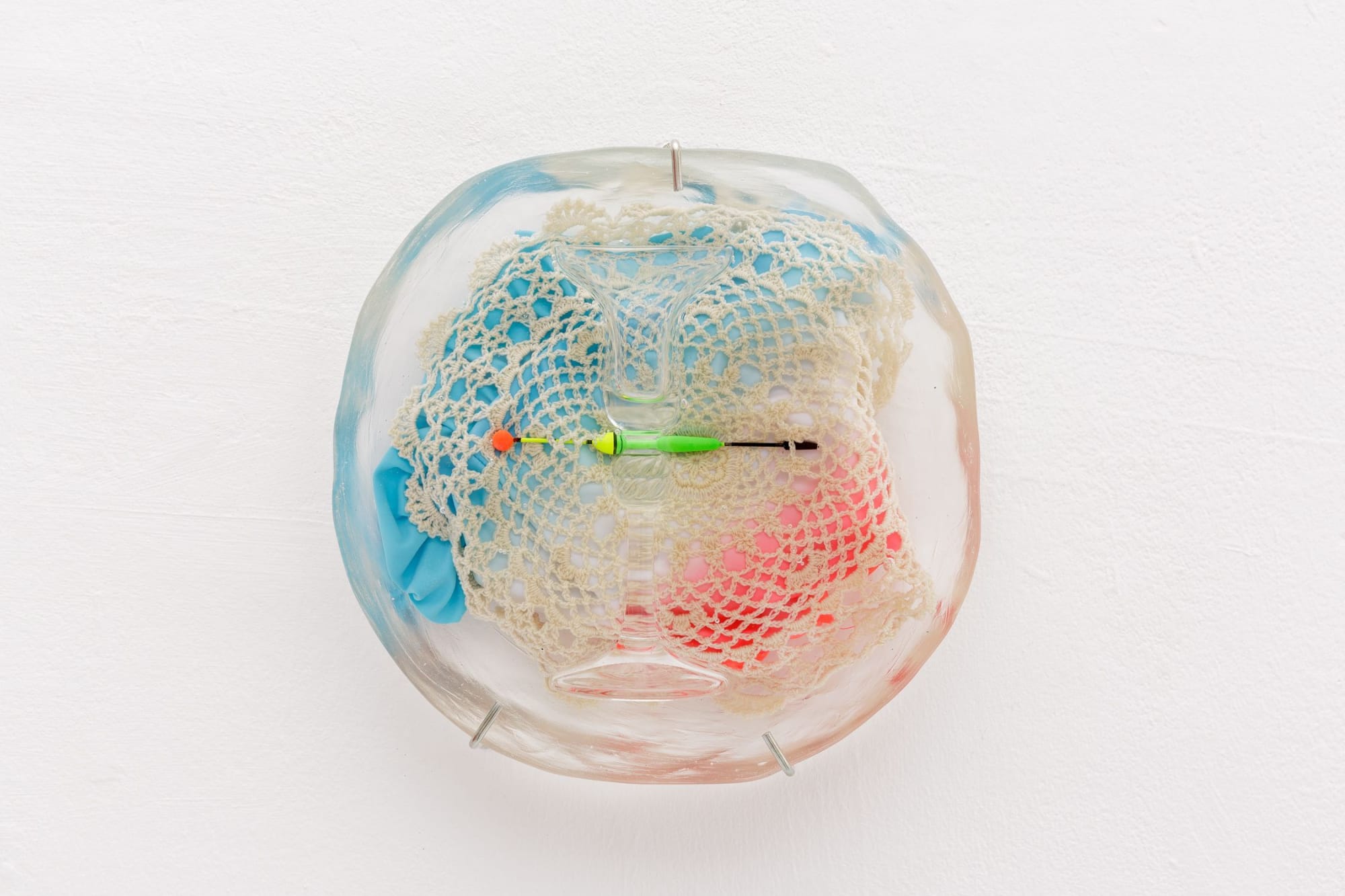 Insoluable Blossoms III 2019 Resin, glassware, child swimsuit, crochet doily, fishing float 25 x 26 x 8 cm