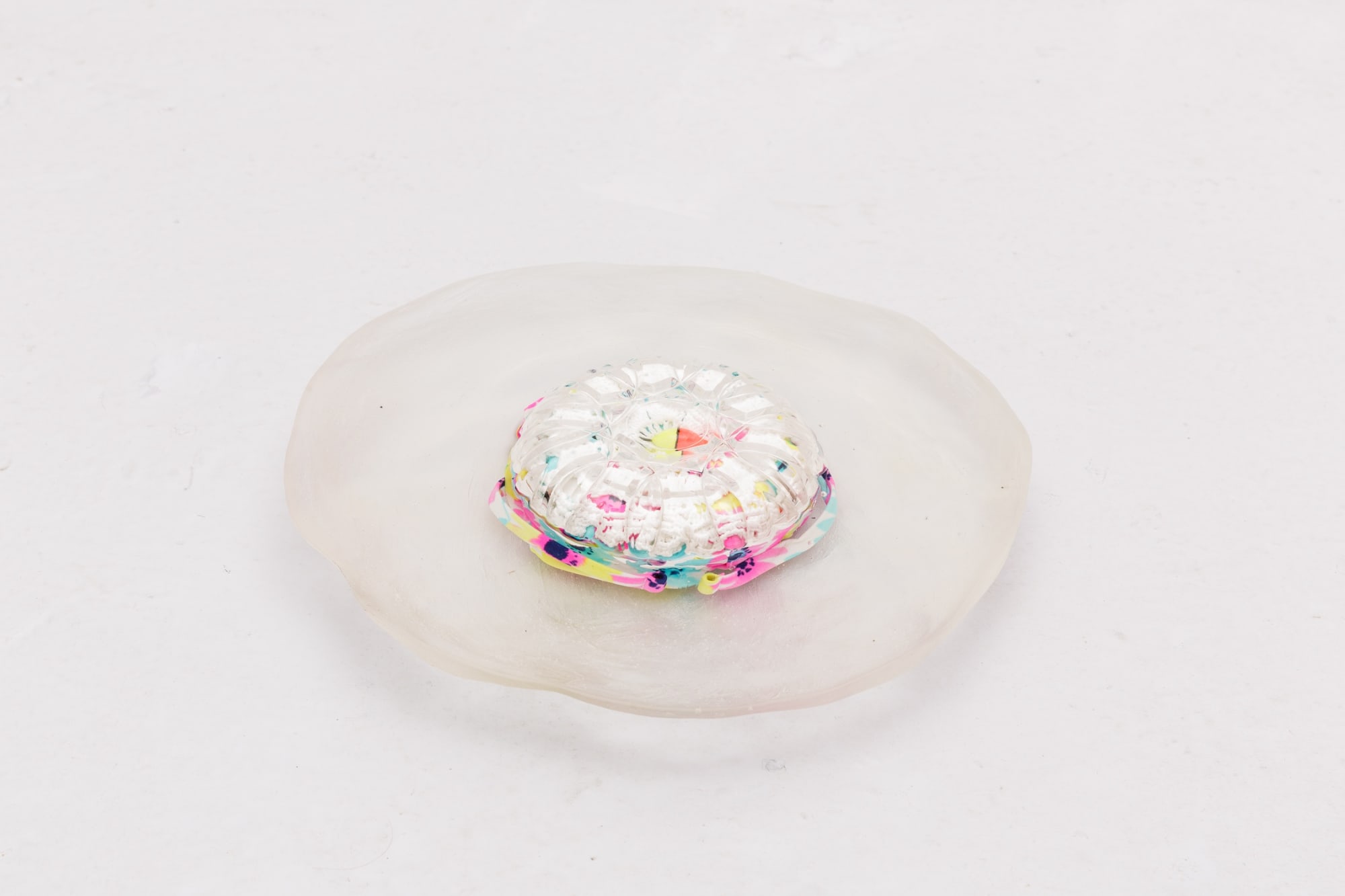 Insoluble Blossoms (II) 2019 Resin, glassware, child swimsuit, crochet doily, fishing float 28 x 25 x 5 cm