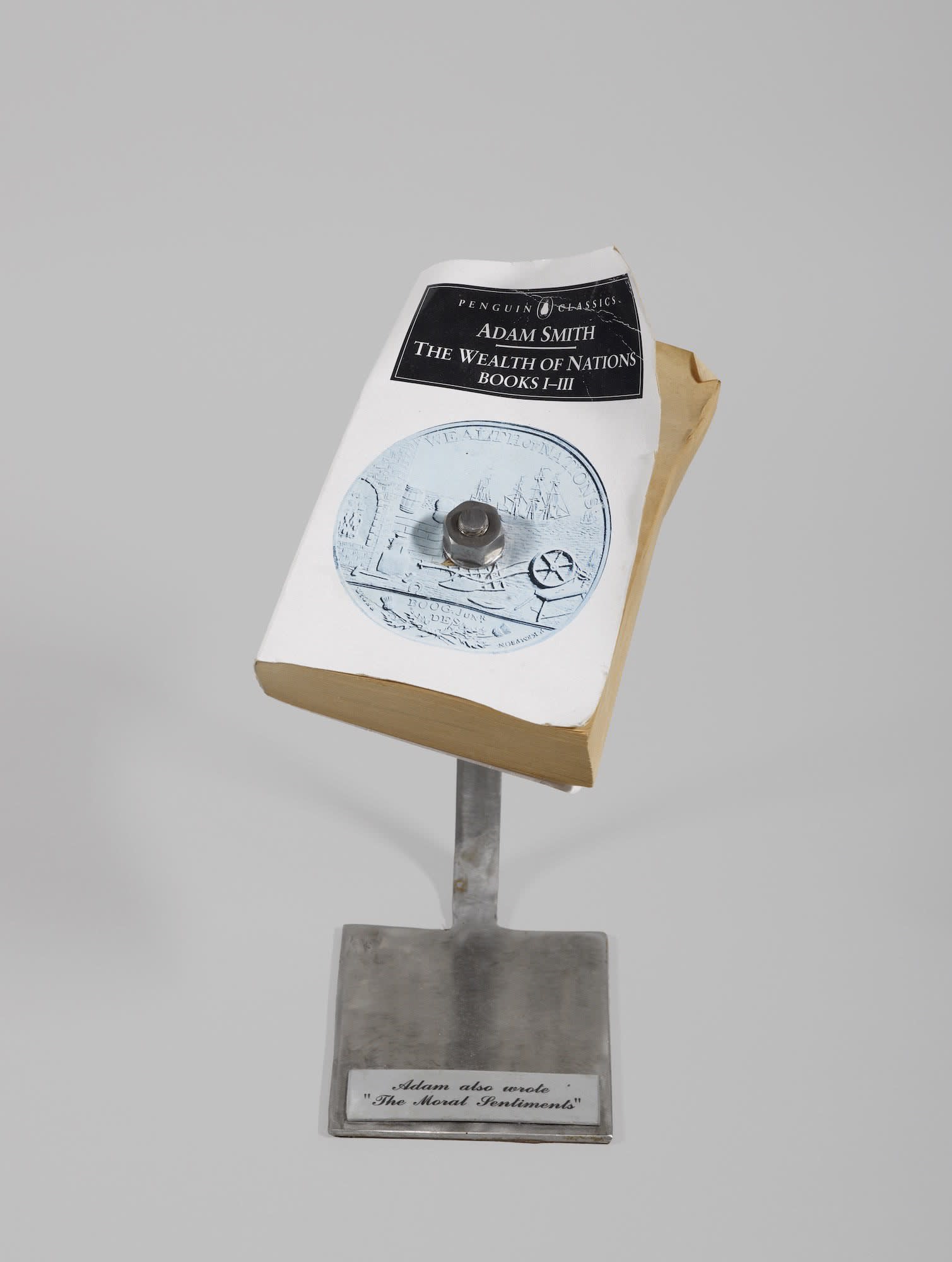 George Ralston Wyllie RSA (1921-2012), Adam also Wrote 'The Moral Sentiments' book on steel stand, 2001, 19.5 x 12.8 x 6.5cm (book)/ 13.0 x 11.3 x 0.5cm (base of stand)/ 29.0cm (height of stand) RSA Diploma Collection (Deposited, 2006) 2006.024