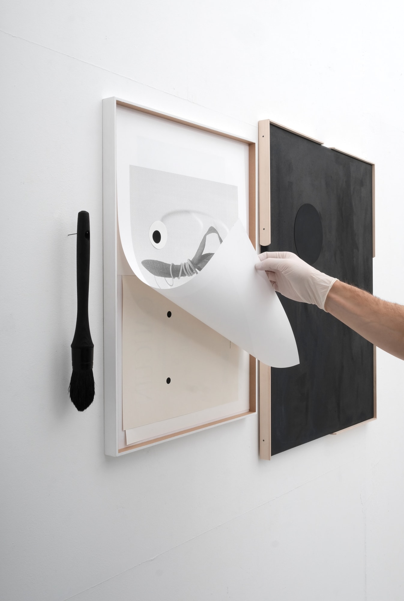 hand holding up print