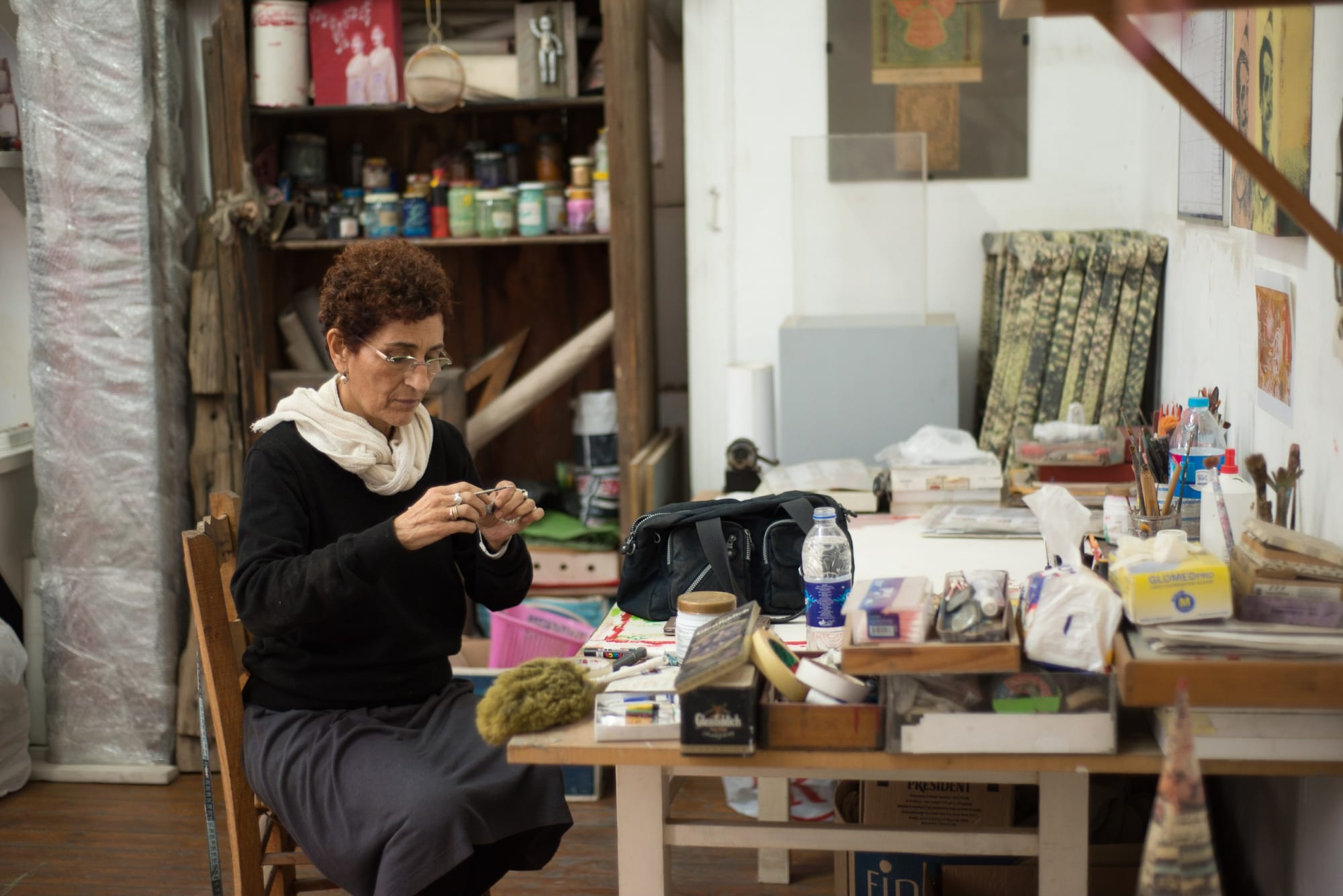 Huda Lutfi working in her studio.