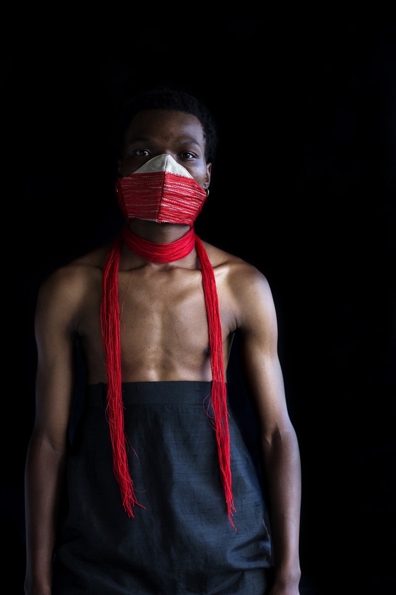 NONZUZO GXEKWA UNTITLED 05, 2020 100 x 68 cm | Edition of 8 plus 2 AP PIERRE LE RICHE UNTITLED V (MASK IN RED WITH TASSELS), 2020 Belgian linen, acrylic yarn, found fabric