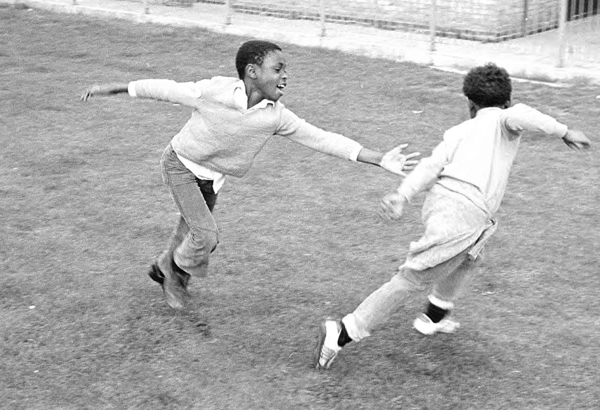 Playing tag, Bolling Road, Hackney, London, 1976