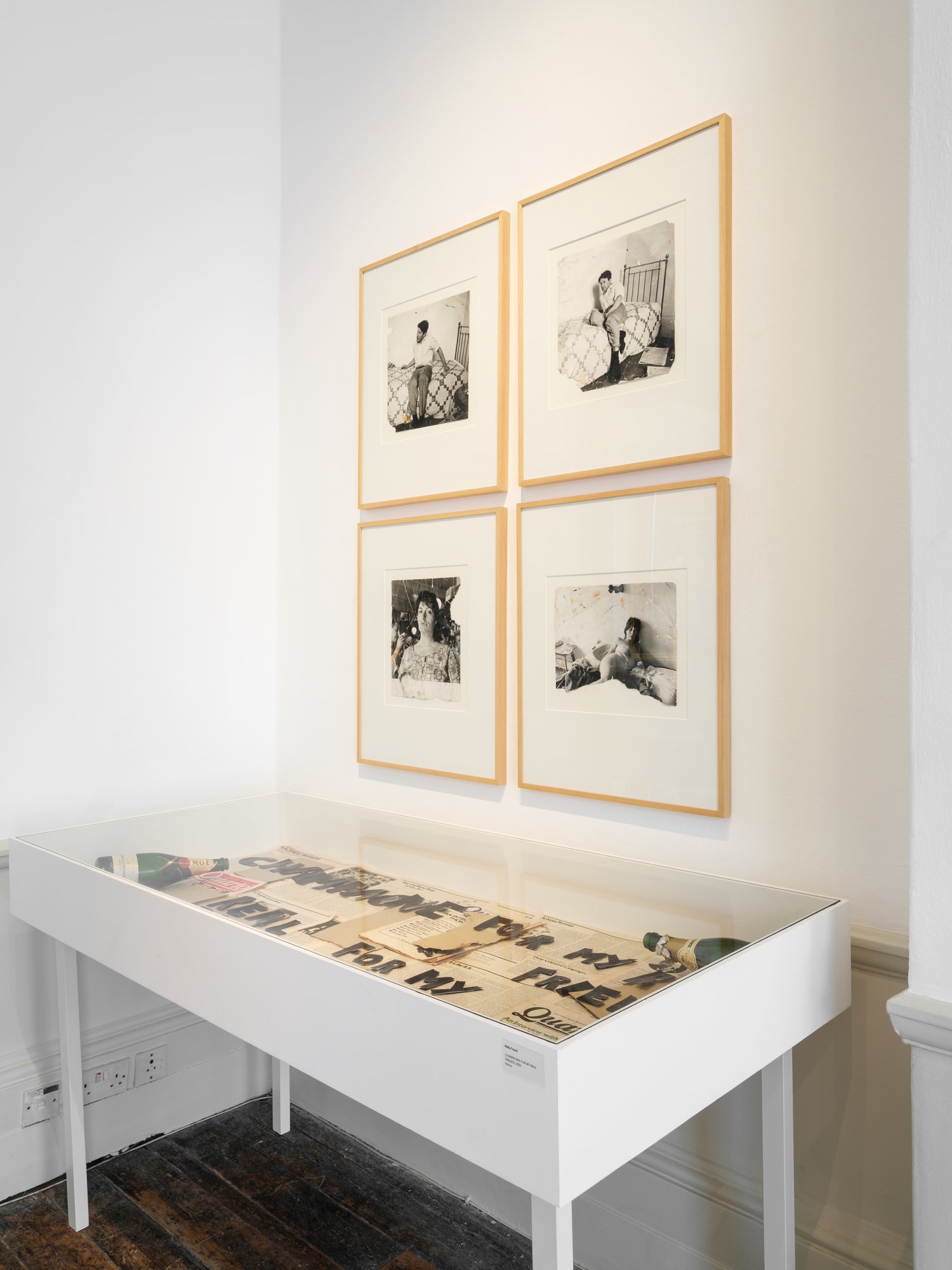 Above: John Deakin Photographs of Lucien Freud and Henrietta Moraes, 1960s Below: CHAMPAGNE FOR MY REAL FRIENDS, vitrine by Bella Freud (2022)