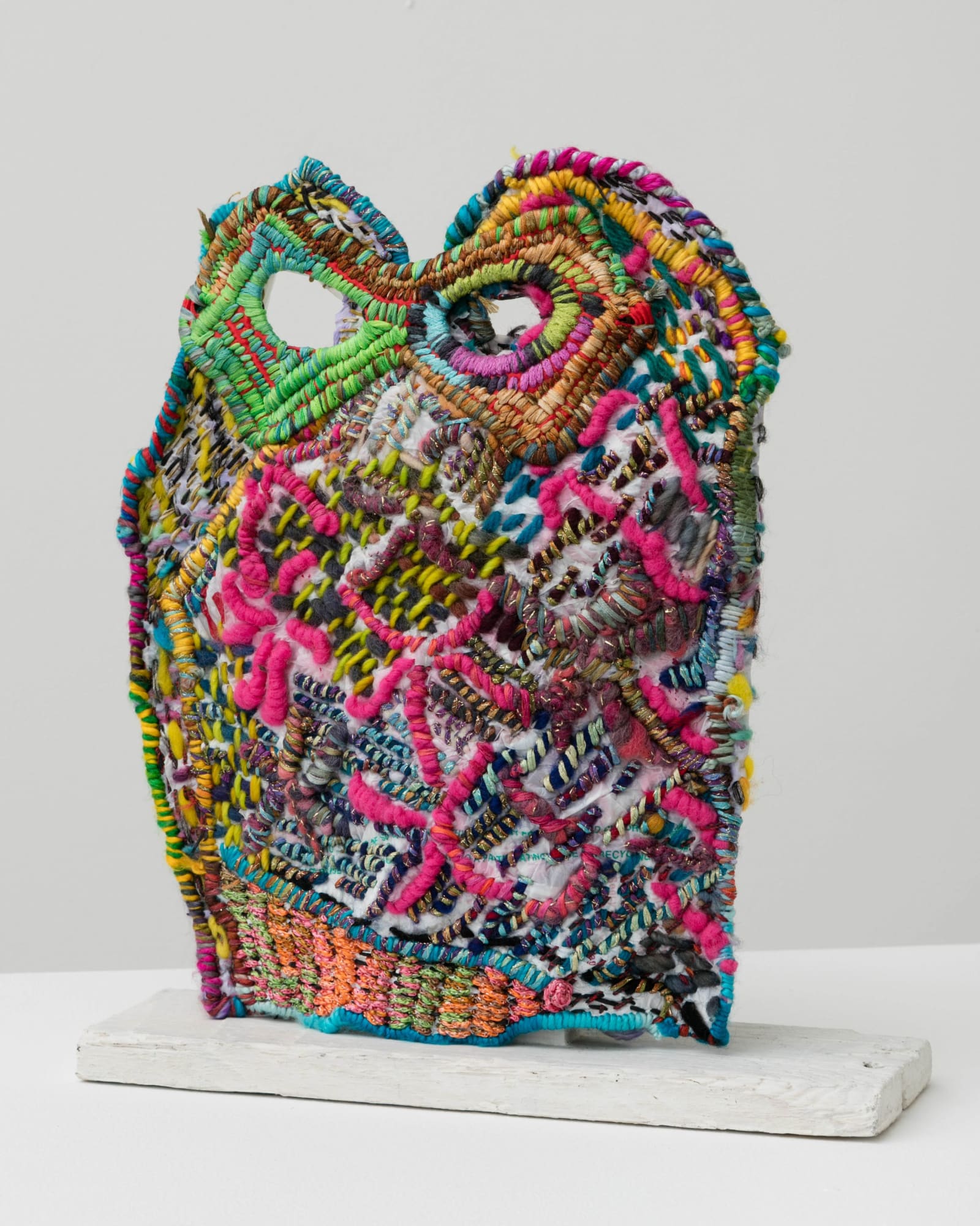 Josh Blackwell Neveruses (Porter) 2015 Plastic, wool, silk, paper, elastic, wooden base 12 x 10 x 3.5 inches (30.5 x 25.4 x 8.9 cm) JBl 2