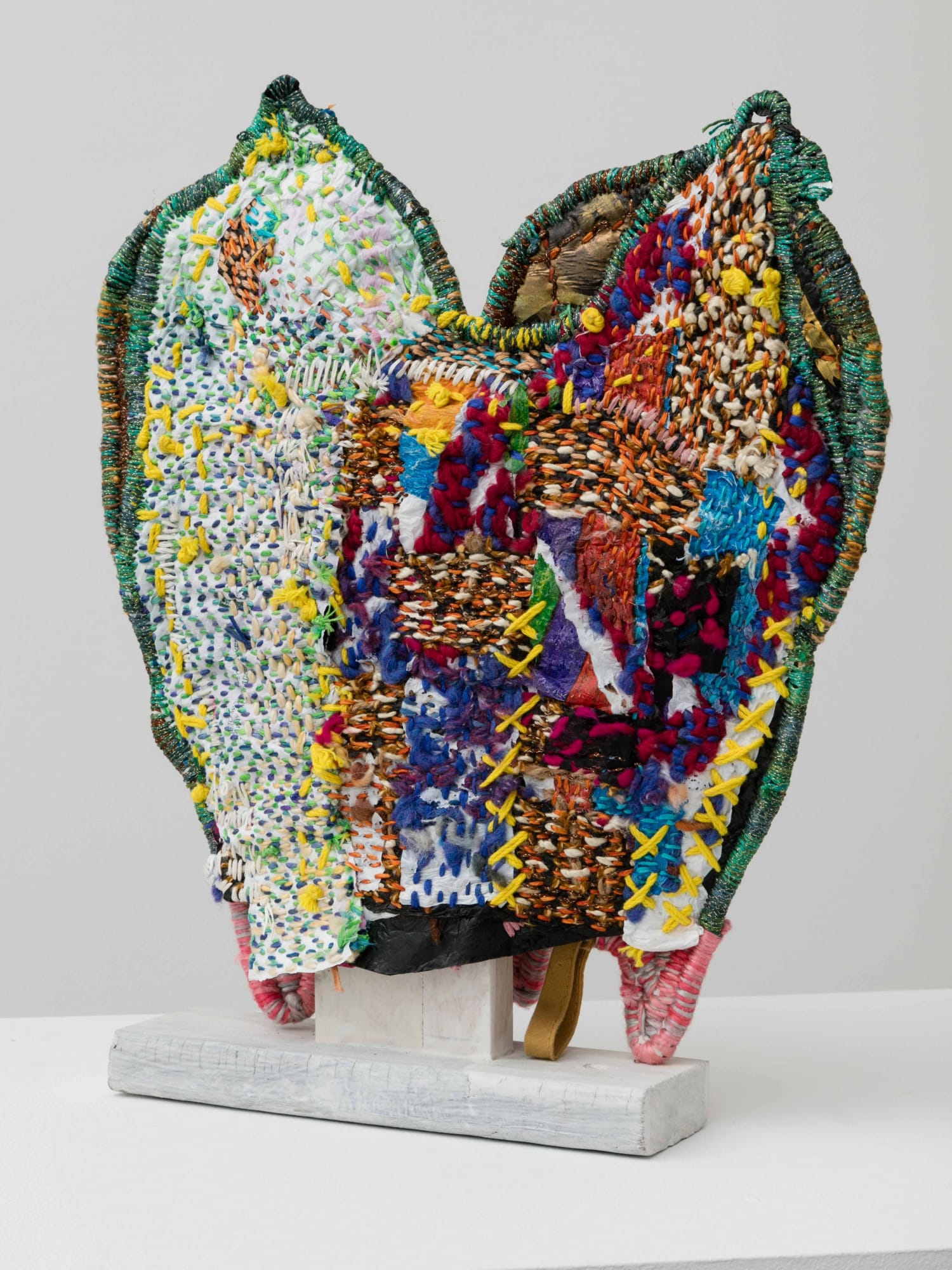 Josh Blackwell Neveruses (Feline) 2015 Plastic, wool, silk, paper, acrylic paint, wooden base 15 x 13 x 2.5 inches (38.1 x 33 x 6.4 cm) JBl 1