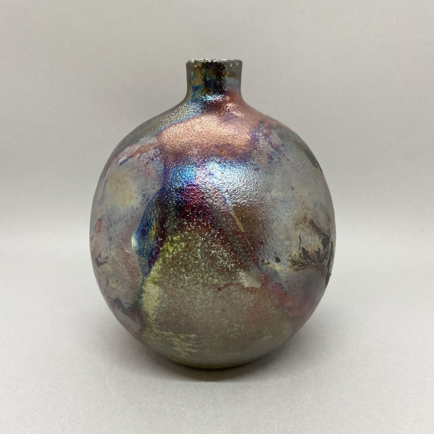 Katie Coston of Illyria Pottery raku fired round bottle vase