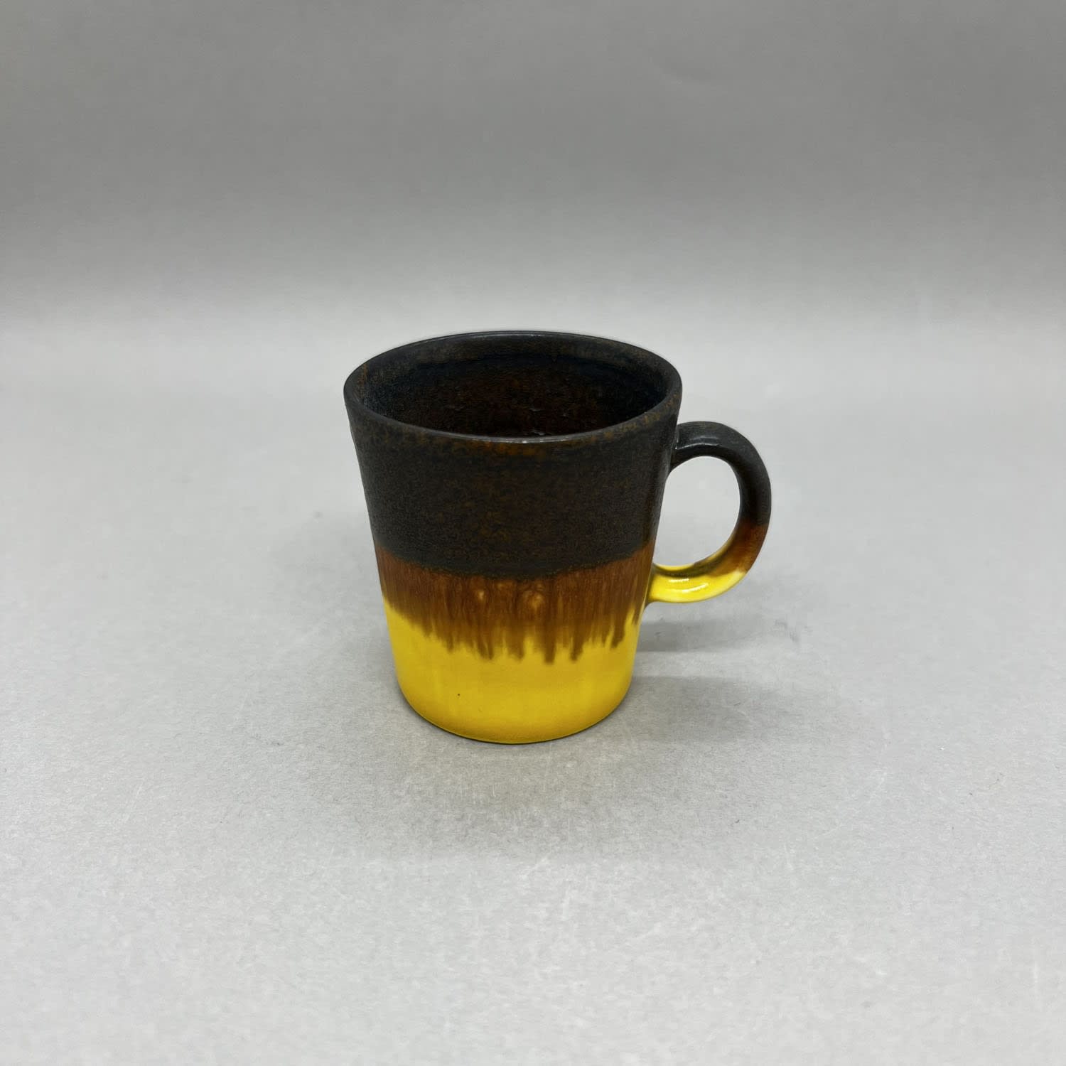 Yuta Segawa espresso cup in a black and lemon yellow glaze