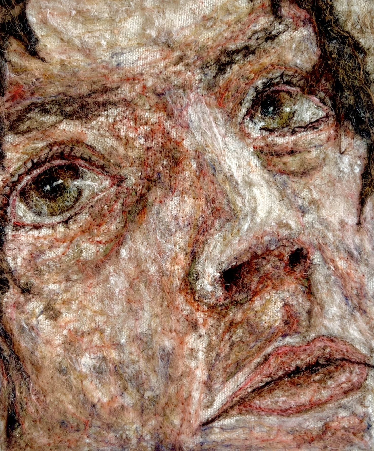 Erin Rosalie Thomas felt needled wool on canvas of a zoomed in portrait showing a face gazing into the distance