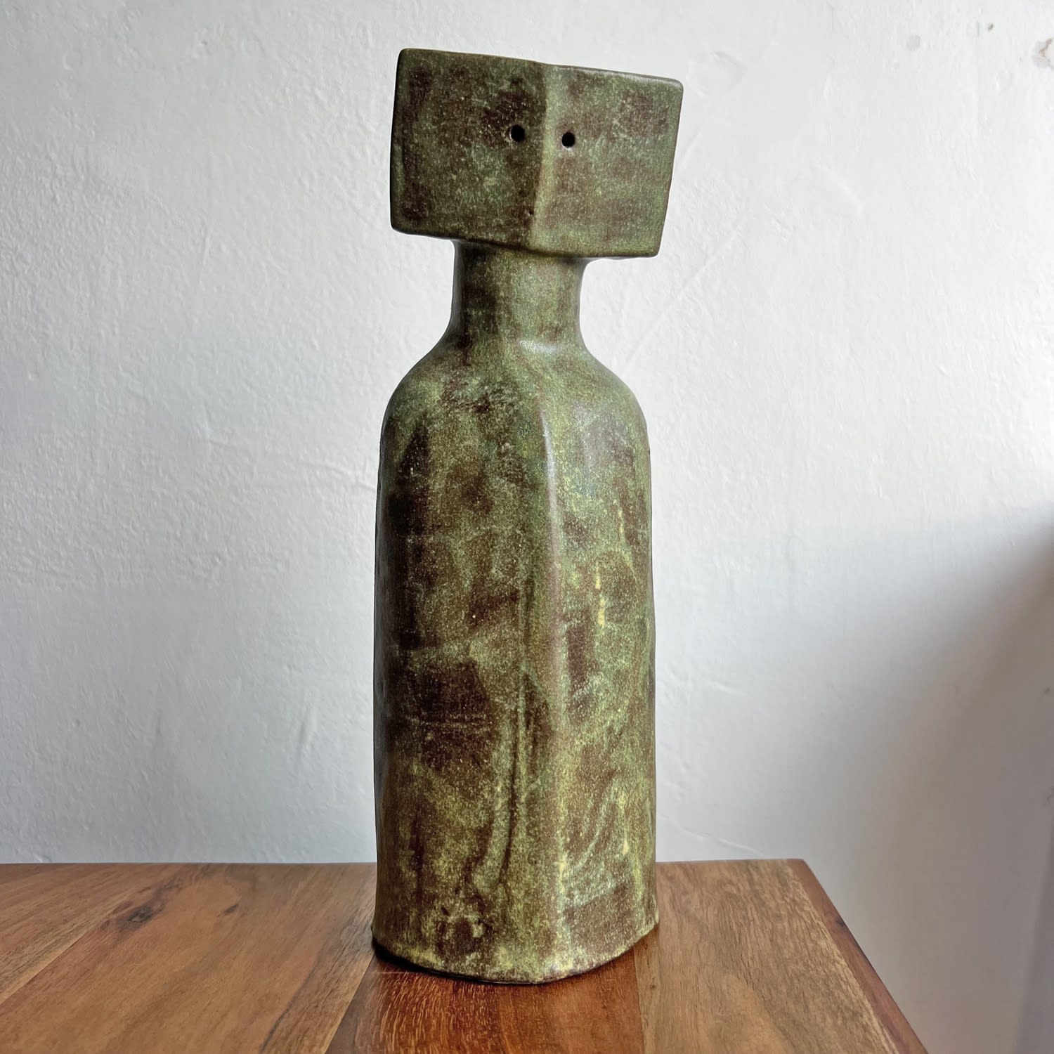 Peter Slight Cycladic ceramic figure with turquoise and bronze speckled glaze and pentagon shaped head with two holes for eyes