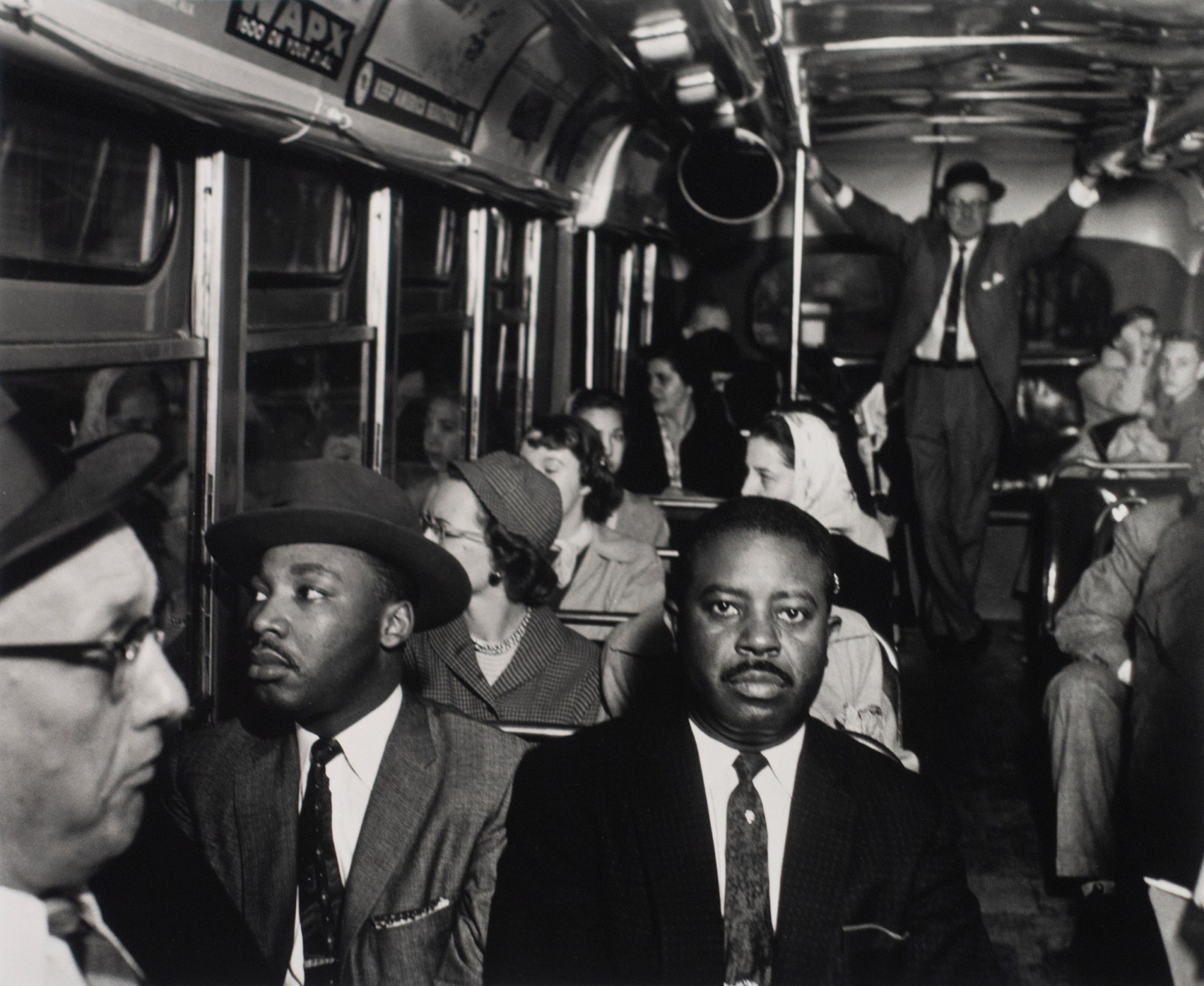 Ernest C. Withers, Dr. Martin Luther King Jr. and Rev. Ralph Abernathy ride on one of the first desegregated buses, Montgomery, AL, December 21, 1956