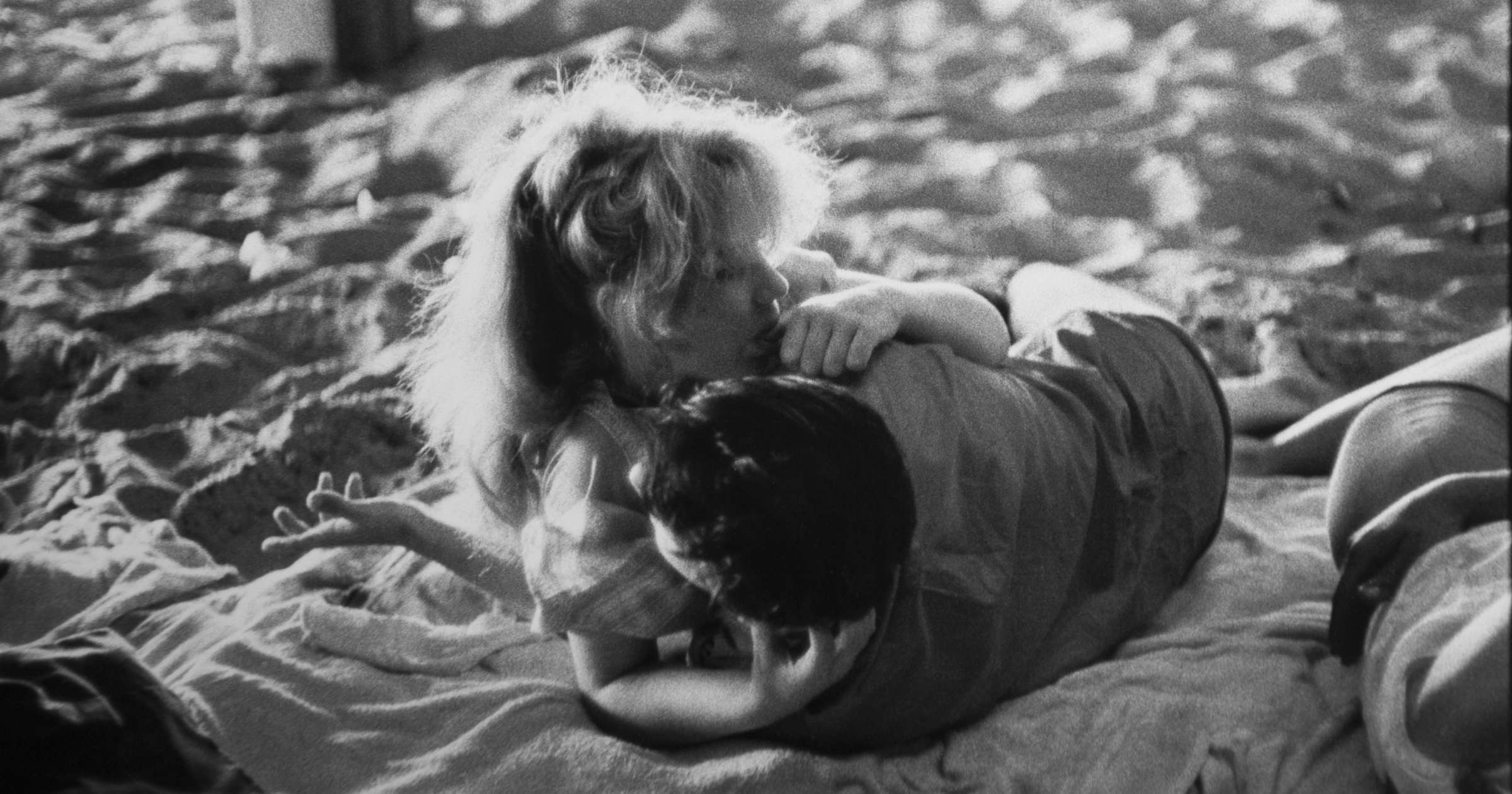 Bruce Davidson, Brooklyn Gang (couple embracing on blanket under  boardwalk), 1959 | Jackson Fine Art