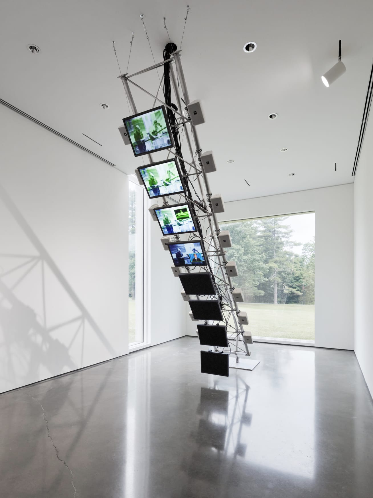 Installation by Dara Birnbaum with many screens in a tower