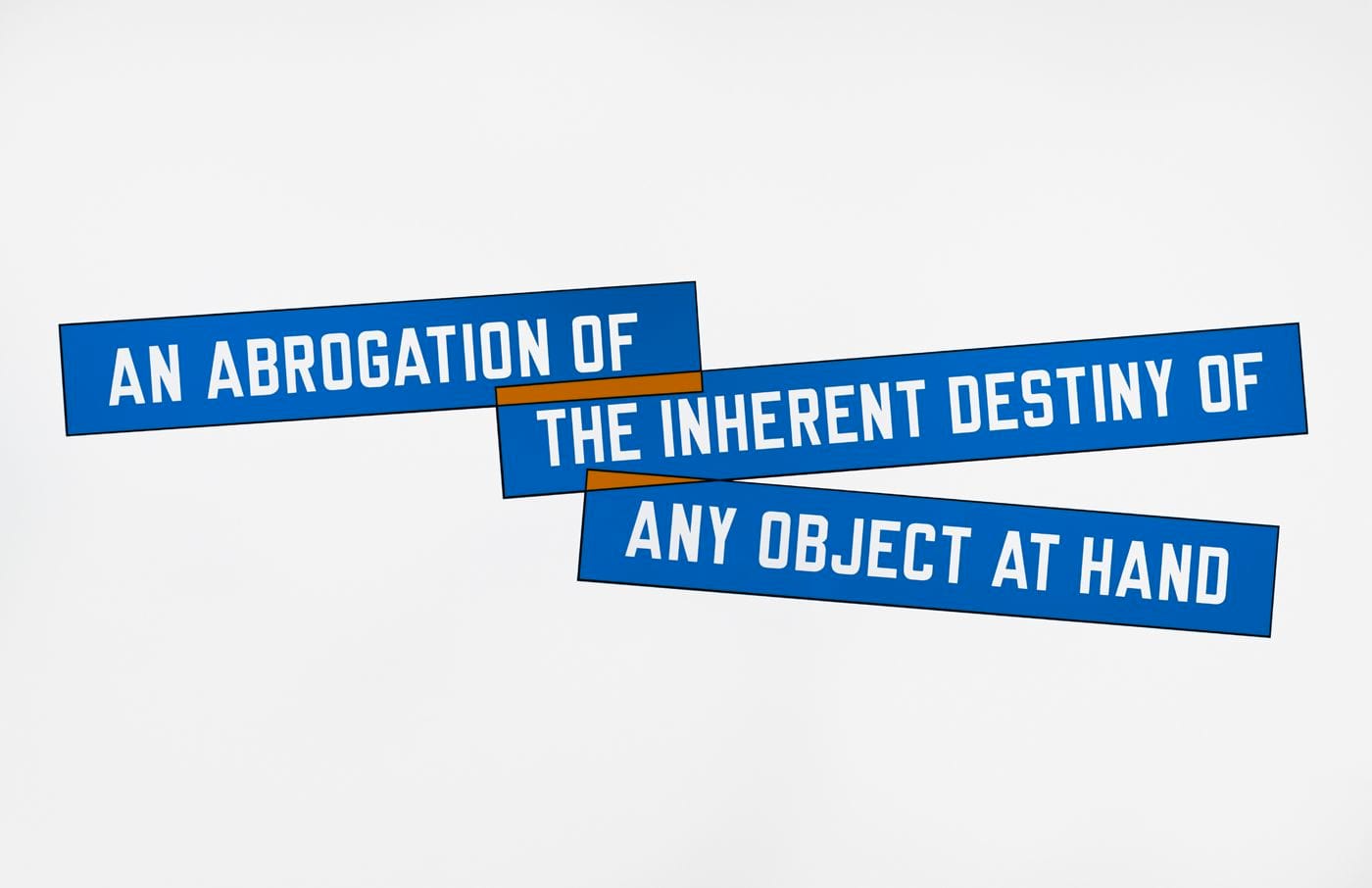 Wall text in three blue boxes in white font read from left to right "AN ABROGATION OF" "THE INHERENT DESTINY OF" "ANY OBJECT AT HAND".