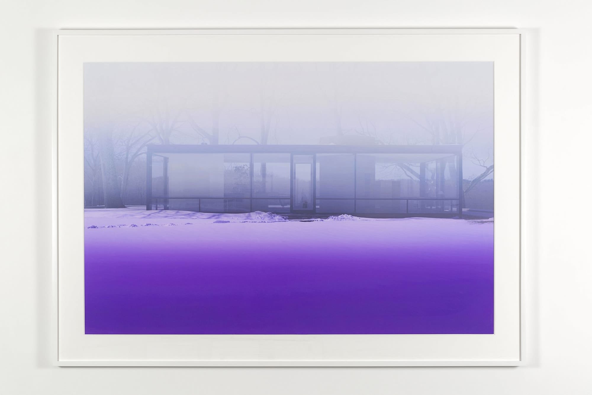 Monochromatic purple photograph of a rectangular glass building in a winter landscape on an overcast day.