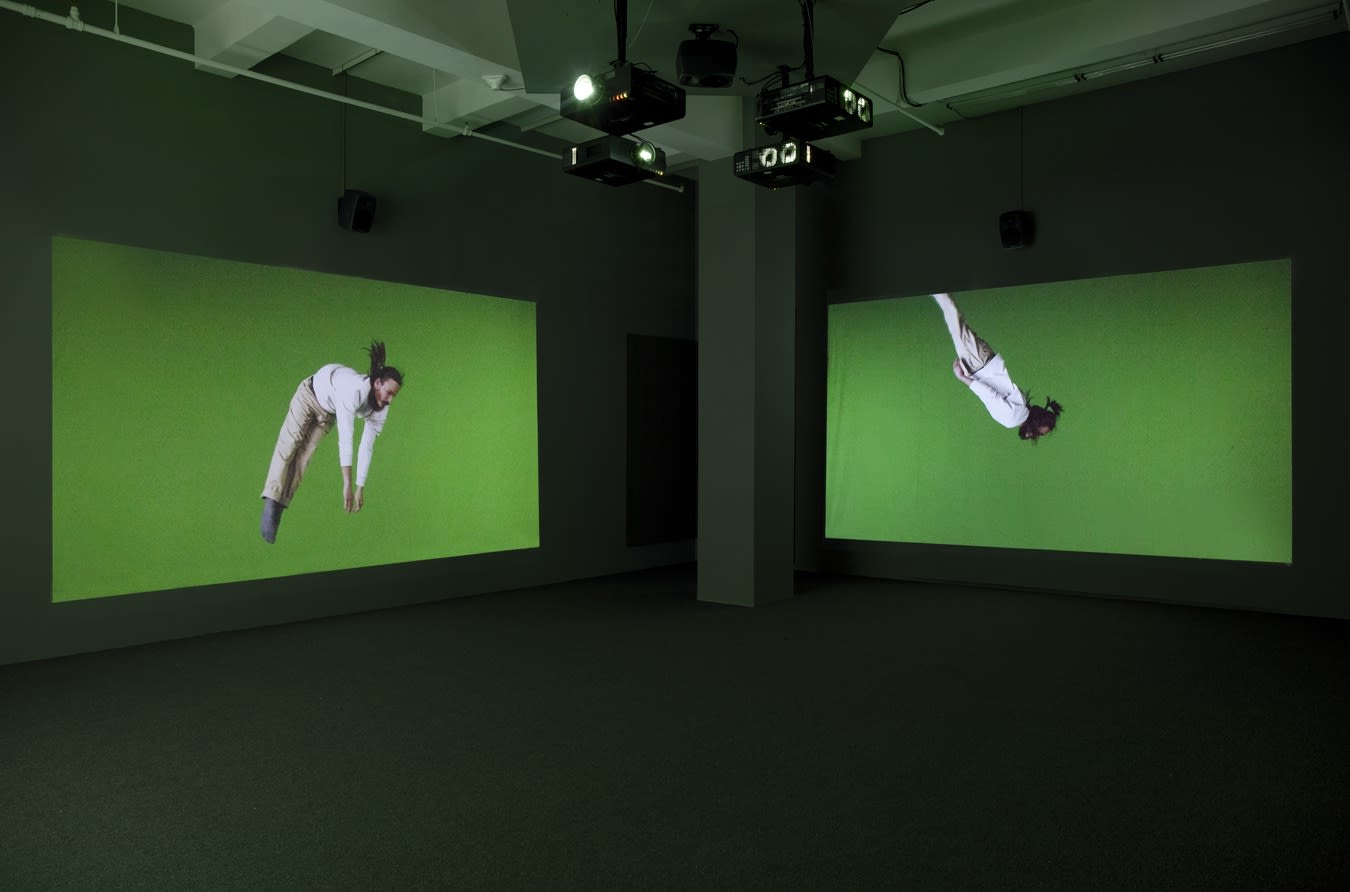 Two projections of person diving through air against a greenscreen backdrop.