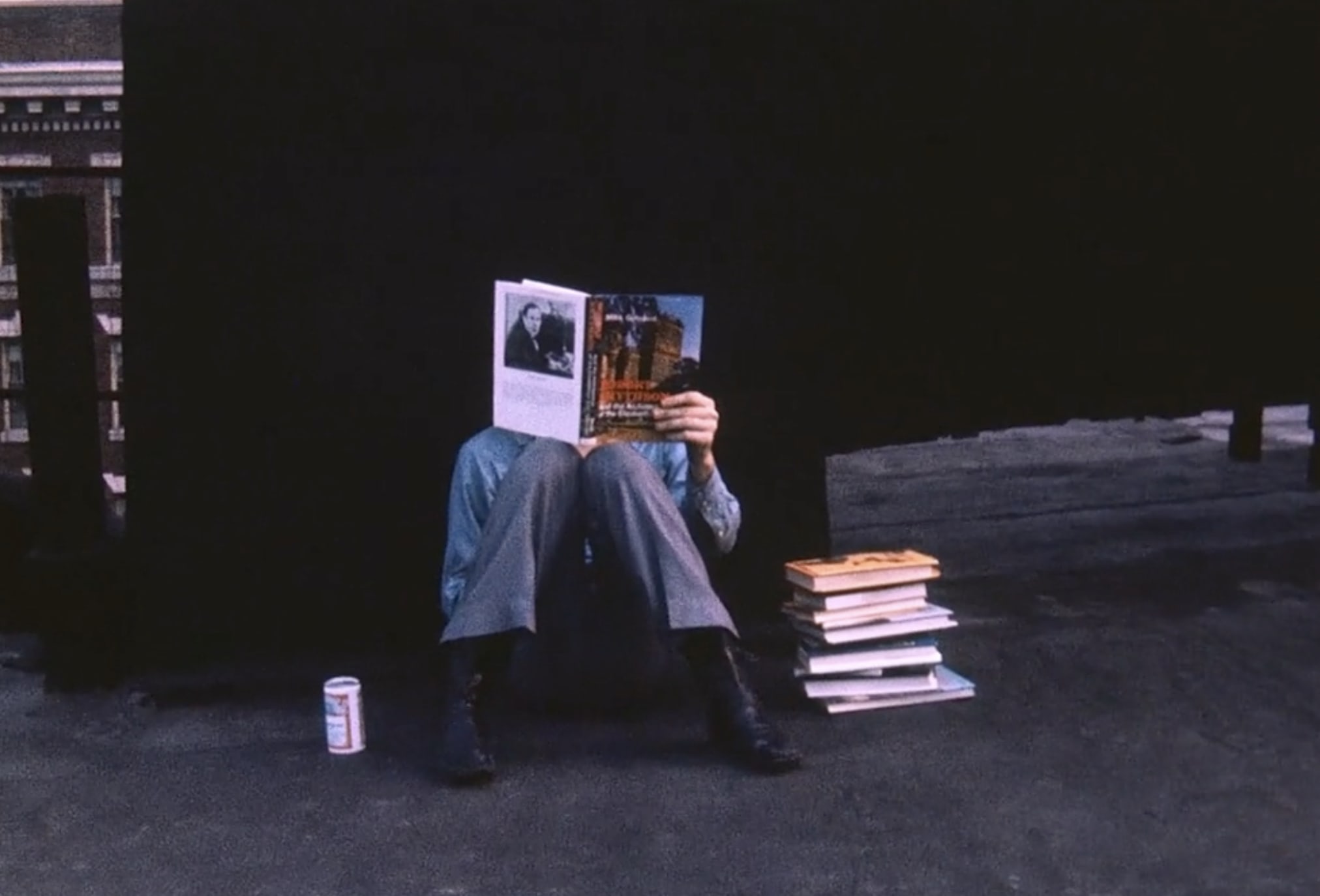 A still from the film "Bob with Books" of Robert Smithson reading books