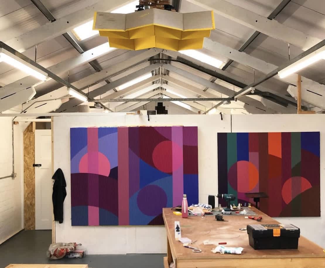 A look inside the Sam Smyth artist studio, where several paintings hang, and his colourful geometric artwork takes shape.