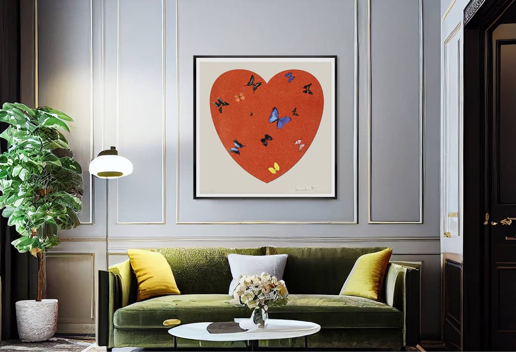 A painting from the Love Heart series by Damien Hirst hangs on a living room wall. The owner recently purchased this piece from Maddox Gallery, a consignment art gallery that specialises in fine art resale.