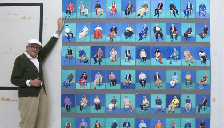 Hockney poses with his valuable David Hockney painting for sale, titled “83 Portraits and 1 Still Life.”